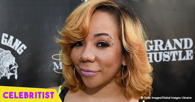 Tiny Harris holds daughter Heiress in her arms in touching new picture