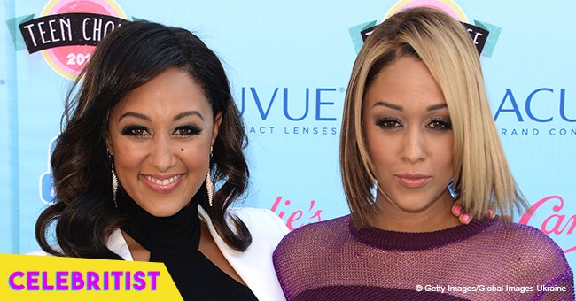 Tia and Tamera Mowry rock long curly hair in recent pics from their 70's themed bday bash