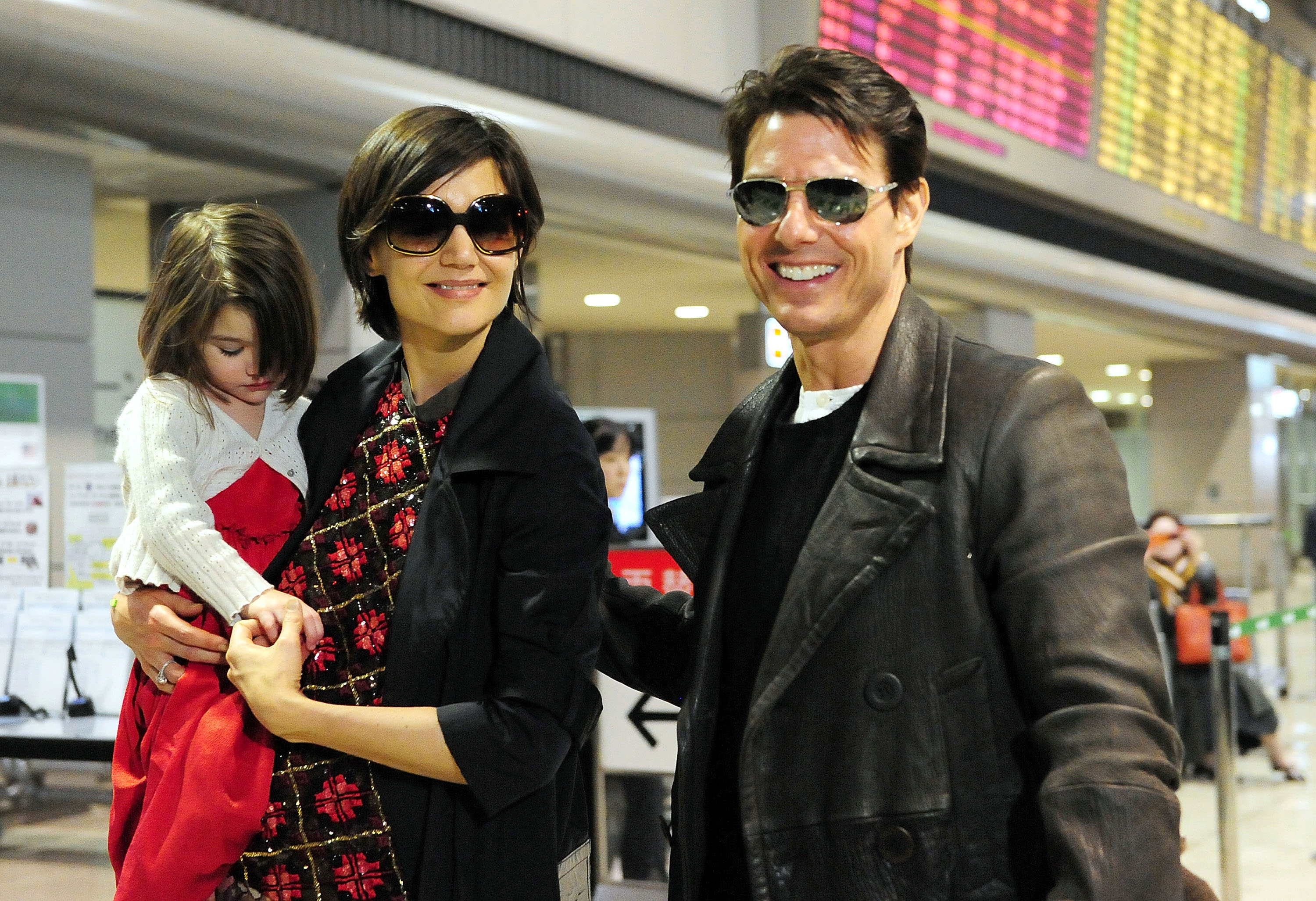 Tom Cruise, Katie Holmes and Suri Cruise on March 8, 2009, in Narita, Chiba, Japan.