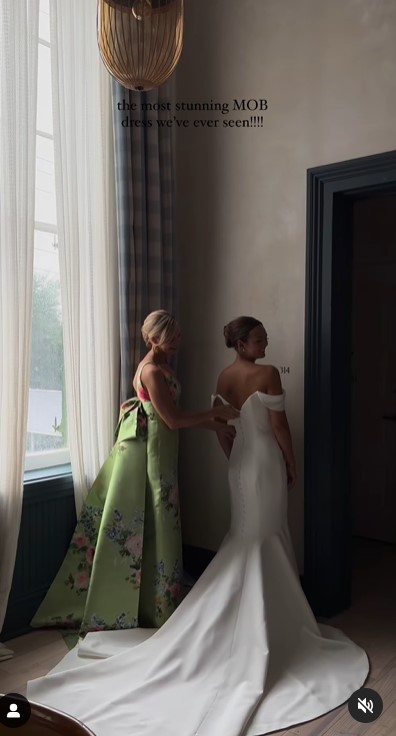 Lori DeWitt and Amanda DeWitt LeBlanc at the latter's wedding in a clip uploaded on June 5, 2024 | Source: Instagram/capturedbychloe.co