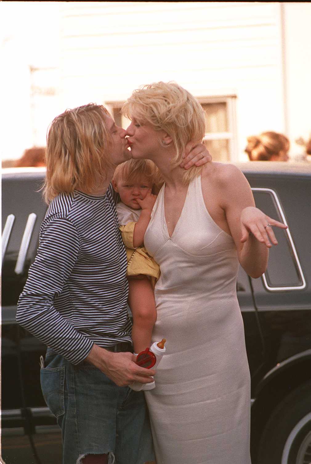 The iconic rocker, his wife, and their baby at the 10th Annual MTV Music Video Awards in Los Angeles, California on September 2, 1993 | Source: Getty Images