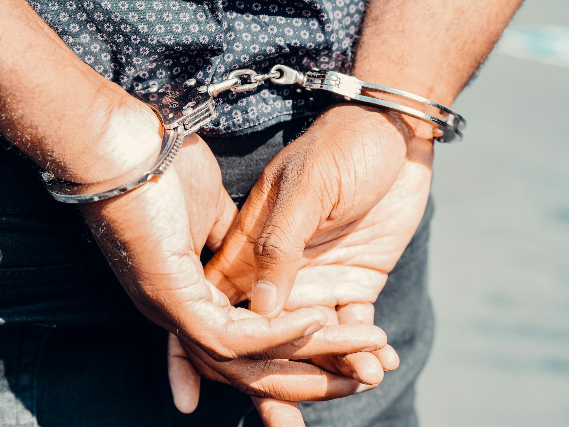 A man in handcuffs | Source: Pexels