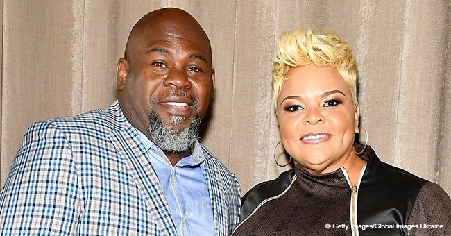 Tamela Mann stuns in half-sleeve top and distressed jeans in pic with husband, David