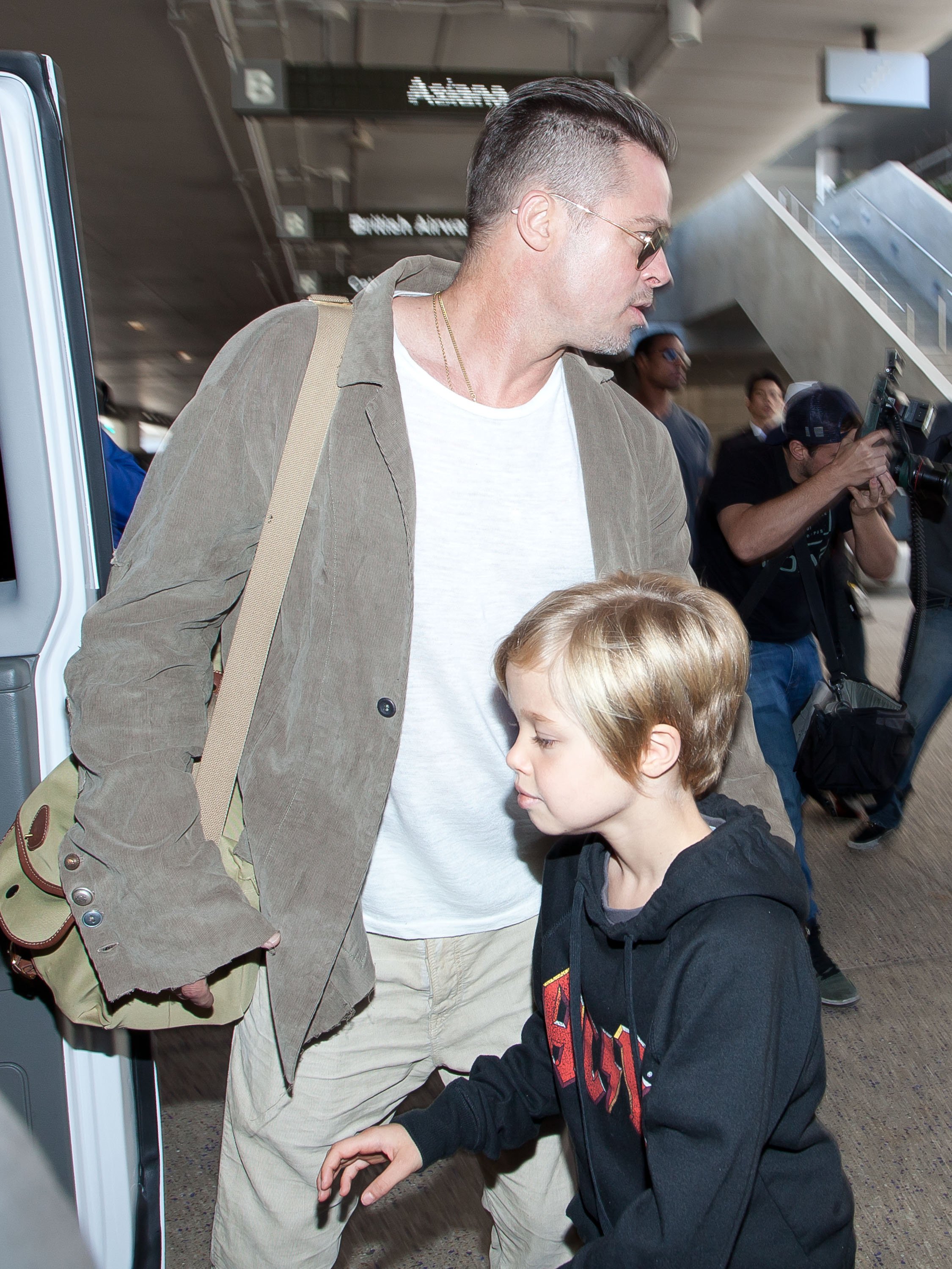 Brad Pitt and Shiloh Jolie-Pitt at the Los Angeles International Airport on February 5, 2014, in Los Angeles, California. | Source: Getty Images