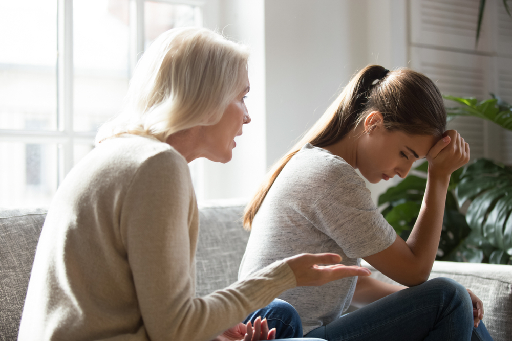 A mom scolding a girl | Source: Shutterstock