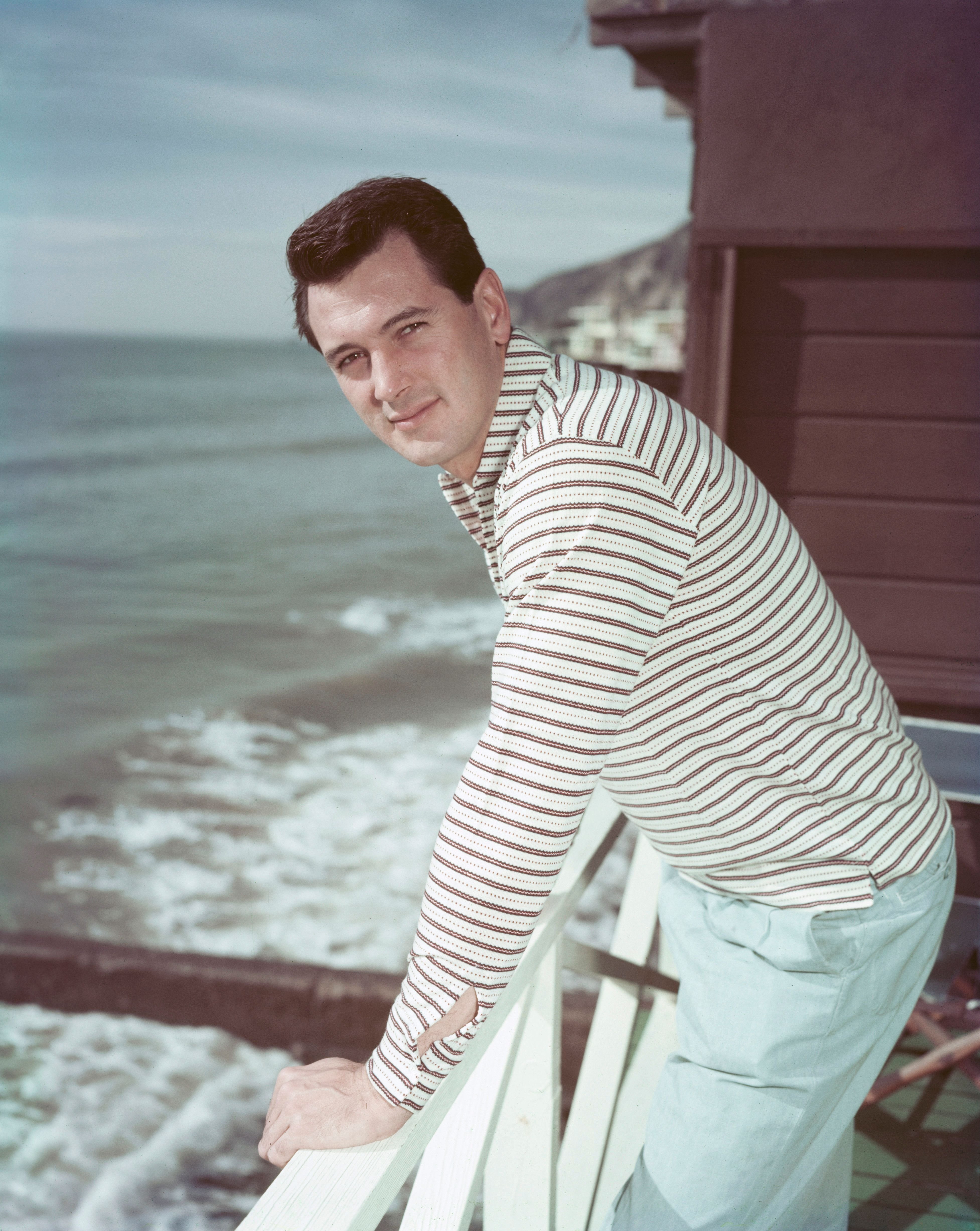 Rock Hudson on the deck of his beach house in Malibu Beach, California, circa 1958 | Source: Getty Images