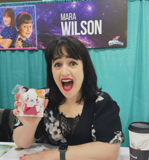Mara Wilson pictured holding a photo, dated December 3, 2023 | Source: Instagram/marawilson