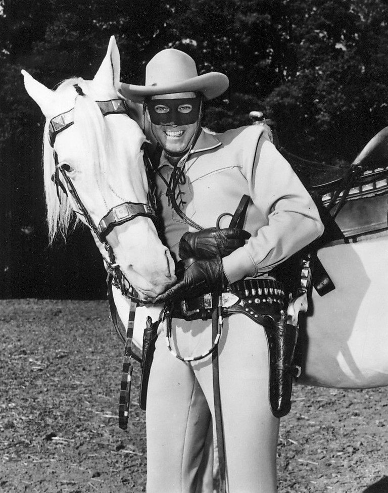 Clayton Moore as the "Lone Ranger" with his horse Silver in 1957. | Source: Wikimedia Commons.