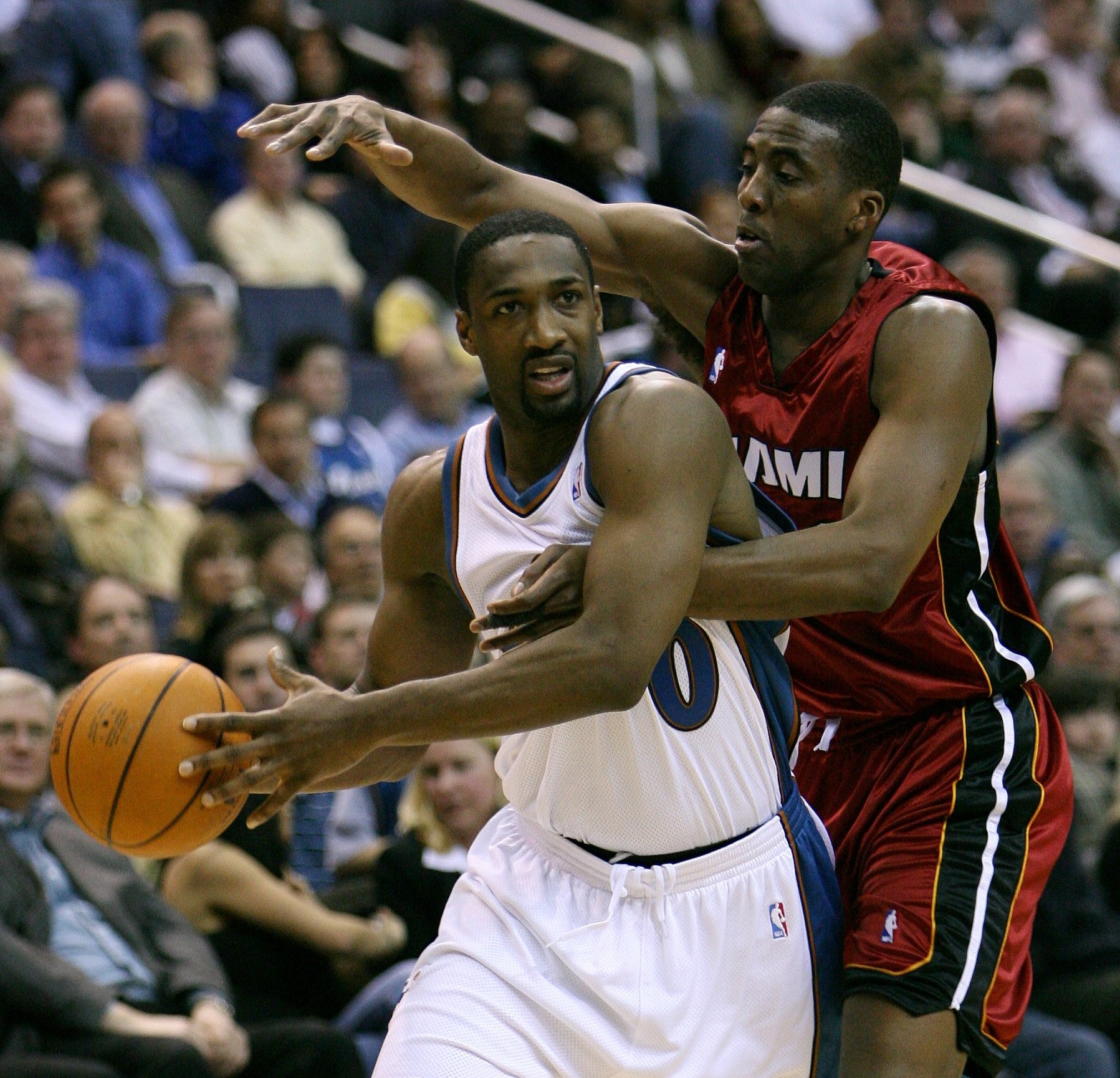 Gilbert Arenas of the Washington Wizards NBA team drives with the basketball while Eddie Jones of the Miami Heat defends, February 2007 | Photo By Keith Allison, CC BY-SA 2.0, Wikimedia Commons Images