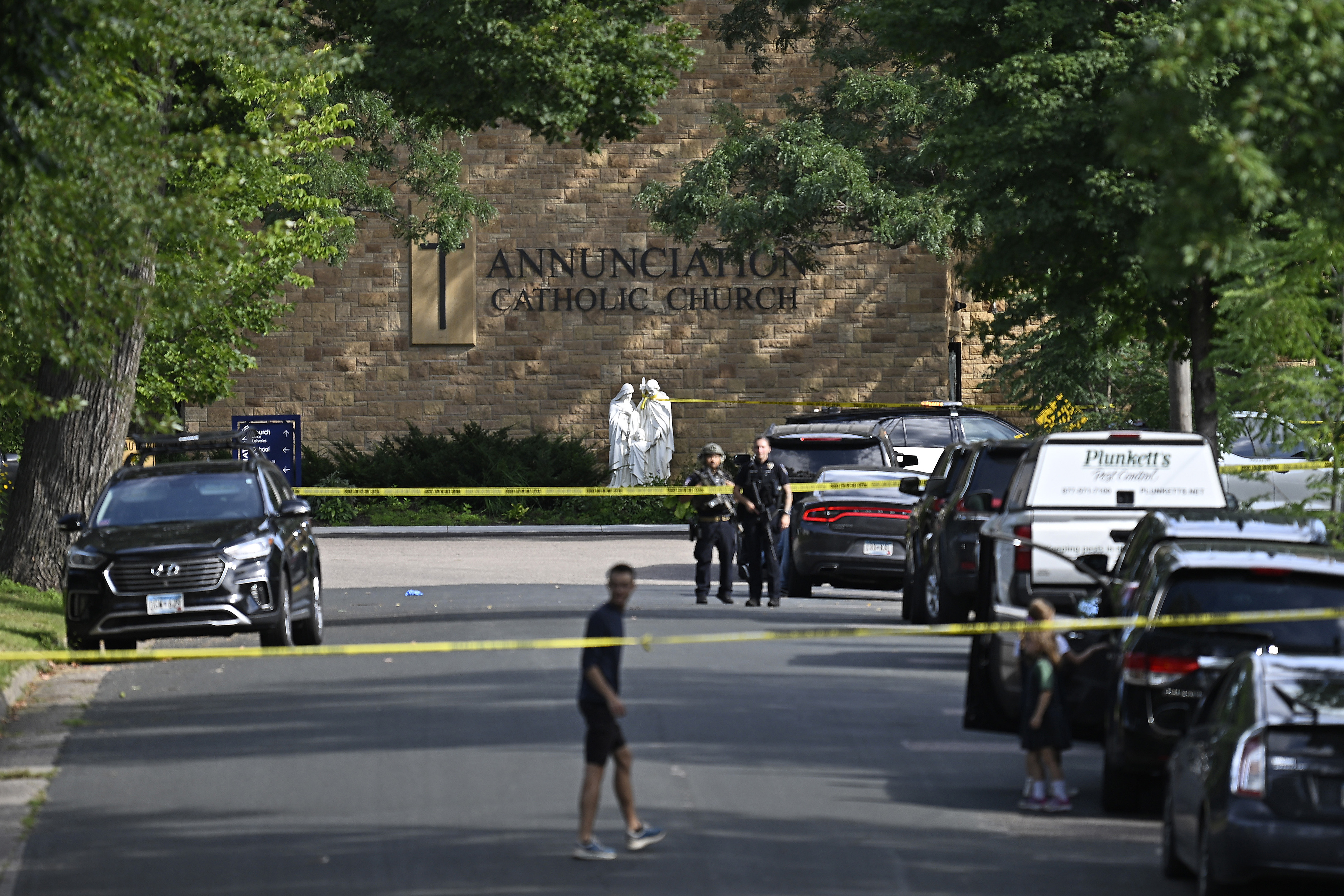 Police secure the scene outside Annunciation Catholic Church after a gunman opened fire during a school Mass, killing two children and injuring others, on August 27, 2025 | Source: Getty Images