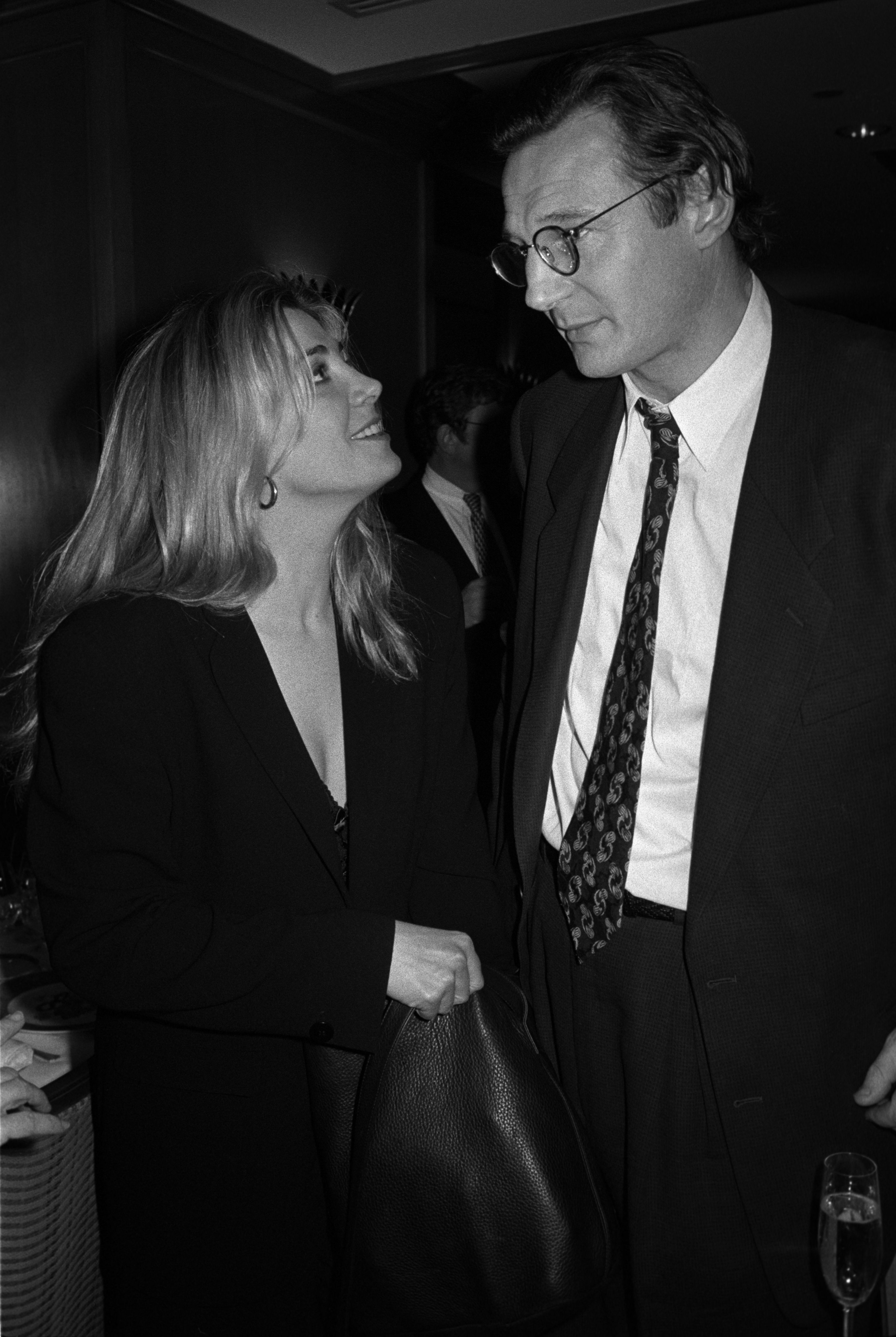 Natasha Richardson looks up at Liam Neeson with a smile as they share a quiet moment together at the premiere party for the film "Blink."
