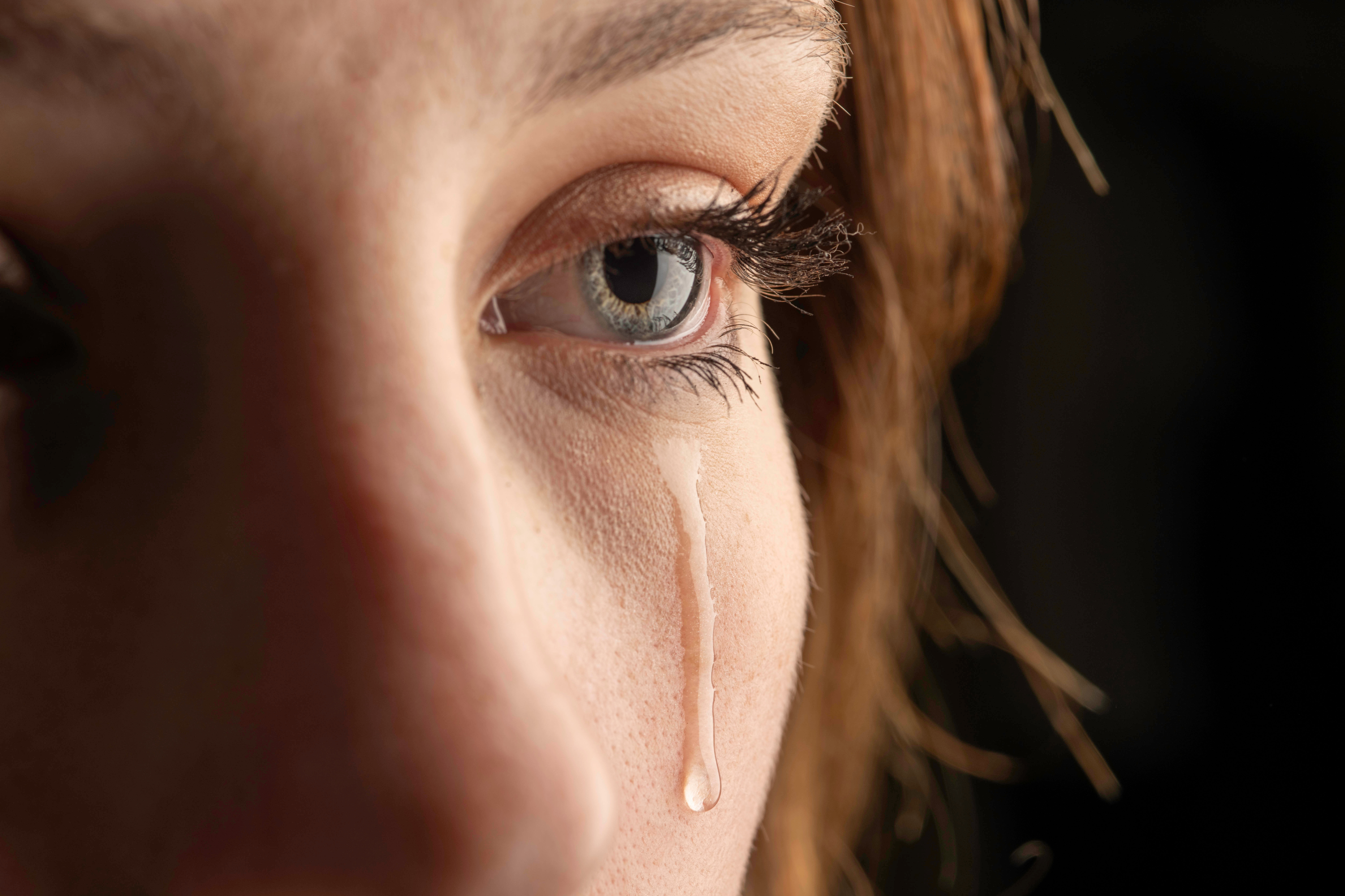 Closeup photo of a young woman crying | Source: Shutterstock