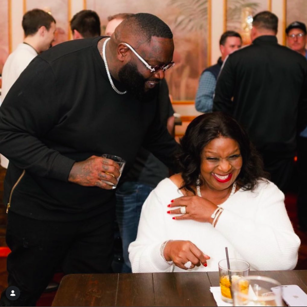Rick Ross and his mother sharing a moment at an event, posted on December 27, 2023. | Source: Instagram/richforever