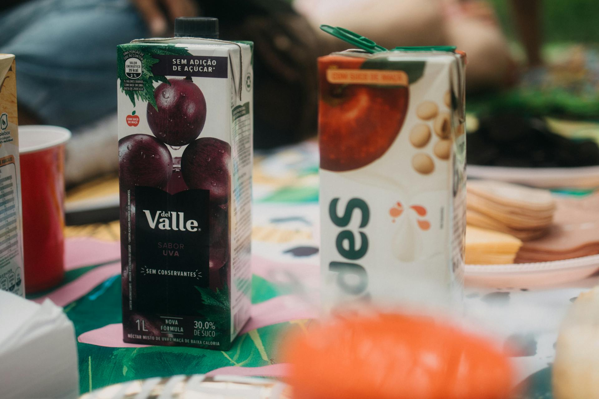Two juice boxes on a table | Source: Pexels