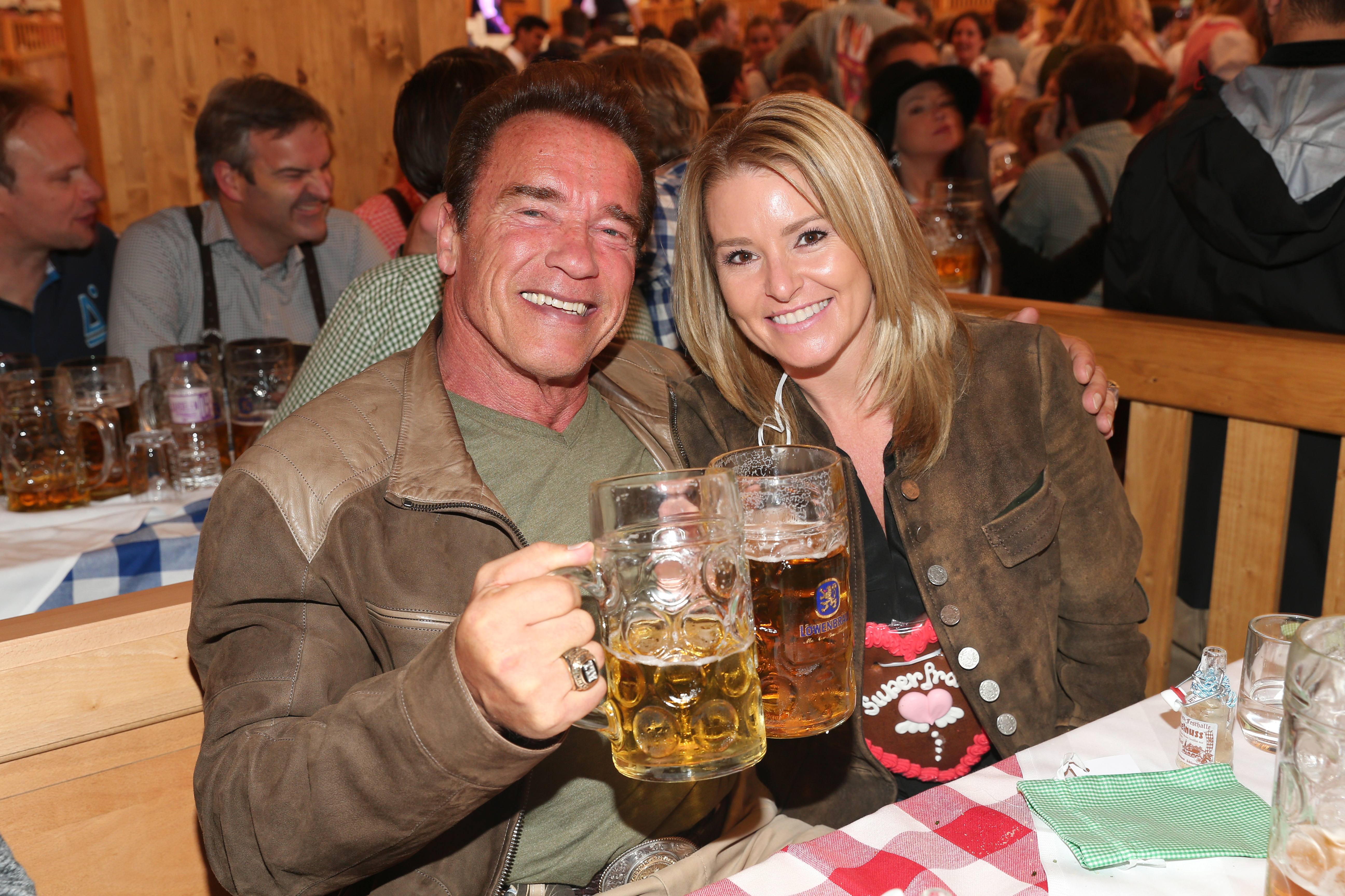 Arnold Schwarzenegger and his partner Heather Milligan visit the Schuetzenfestzelt during the Oktoberfest 2015 at Theresienwiese on September 24, 2015 in Munich, Germany | Source: Getty Images