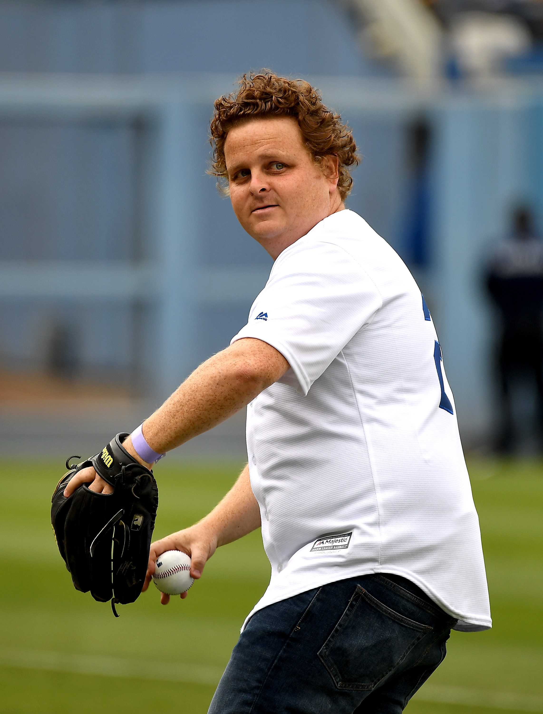 Patrick Renna throws out the first pitch during a cast reunion of the "The Sandlot" to celebrate the movie's 25th anniversary before the game between the Los Angeles Dodgers and the San Francisco Giants at Dodger Stadium on June 16, 2018, in Los Angeles, California | Source: Getty Images