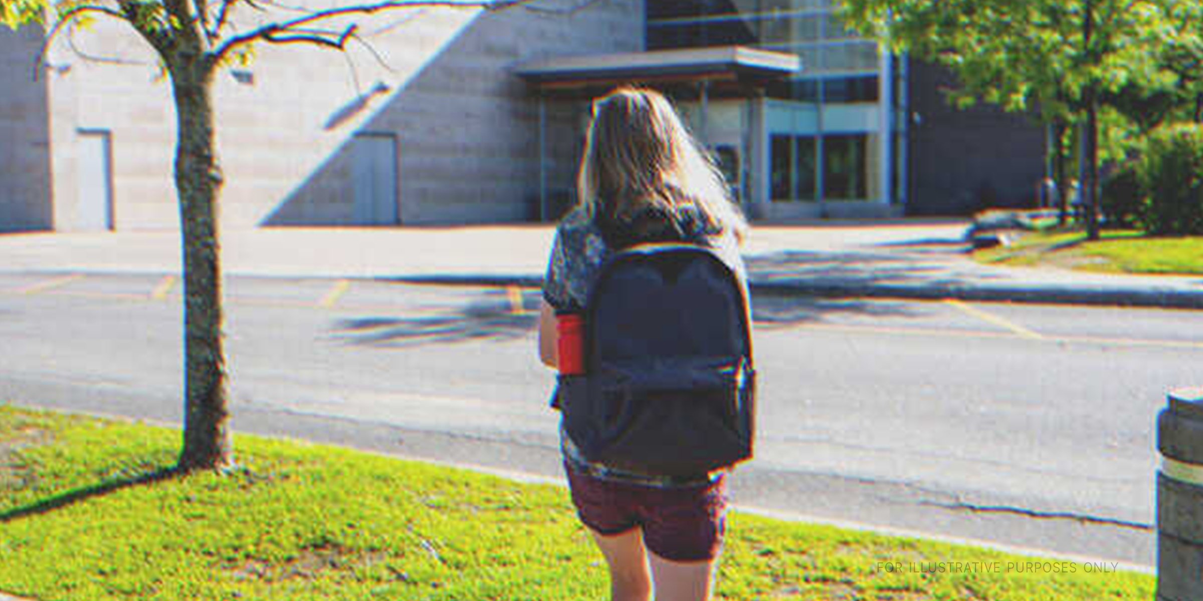 A teenage girl walking to school | Shutterstock
