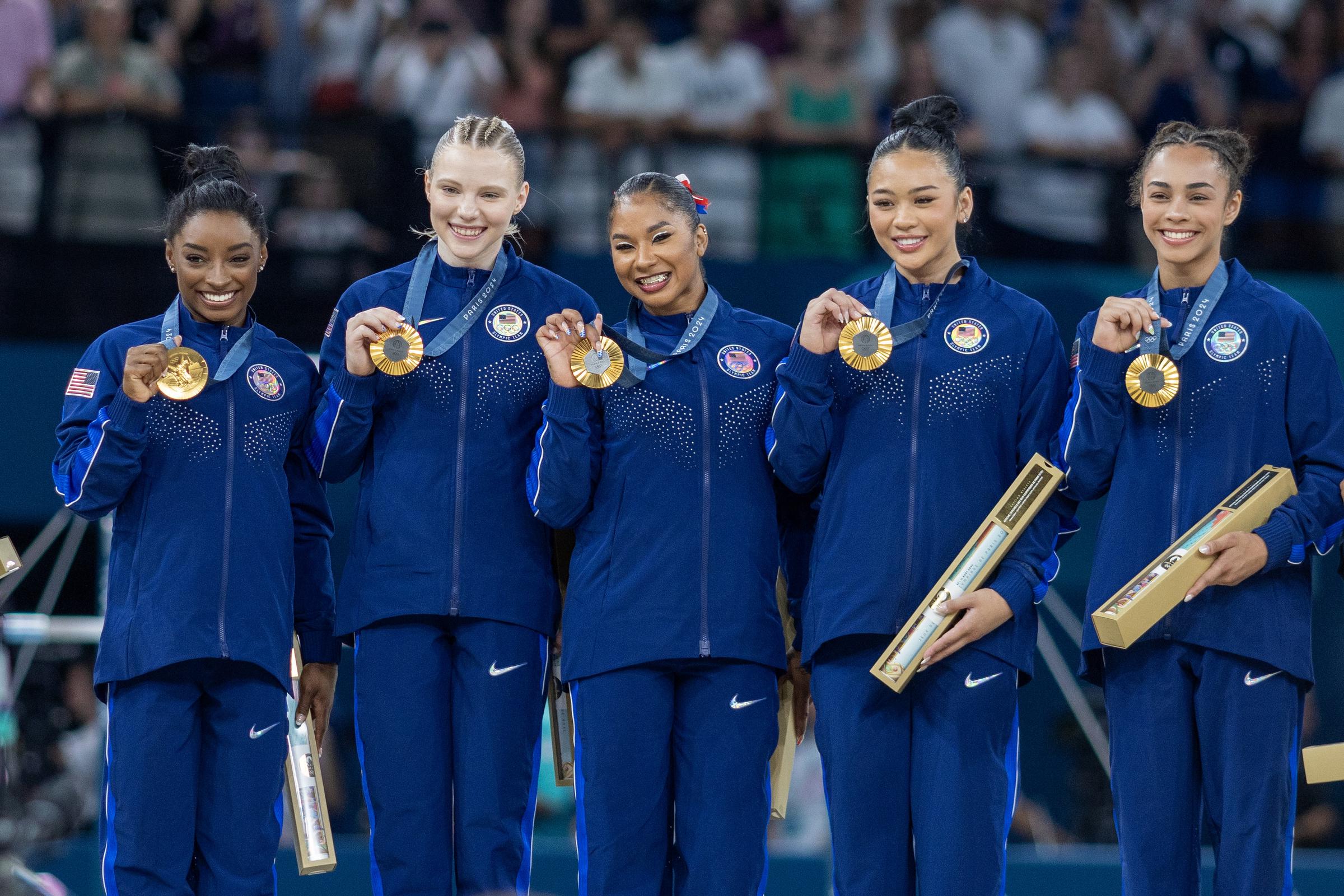 The United States team of Simone Biles, Jade Carey, Jordan Chiles, Suni Lee, and Hezly Rivera with their gold medals during the Artistic Gymnastics Team Final for Women awarding ceremony at the Bercy Arena during the Paris 2024 Summer Olympic Games on July 30, 2024 | Source: Getty Images