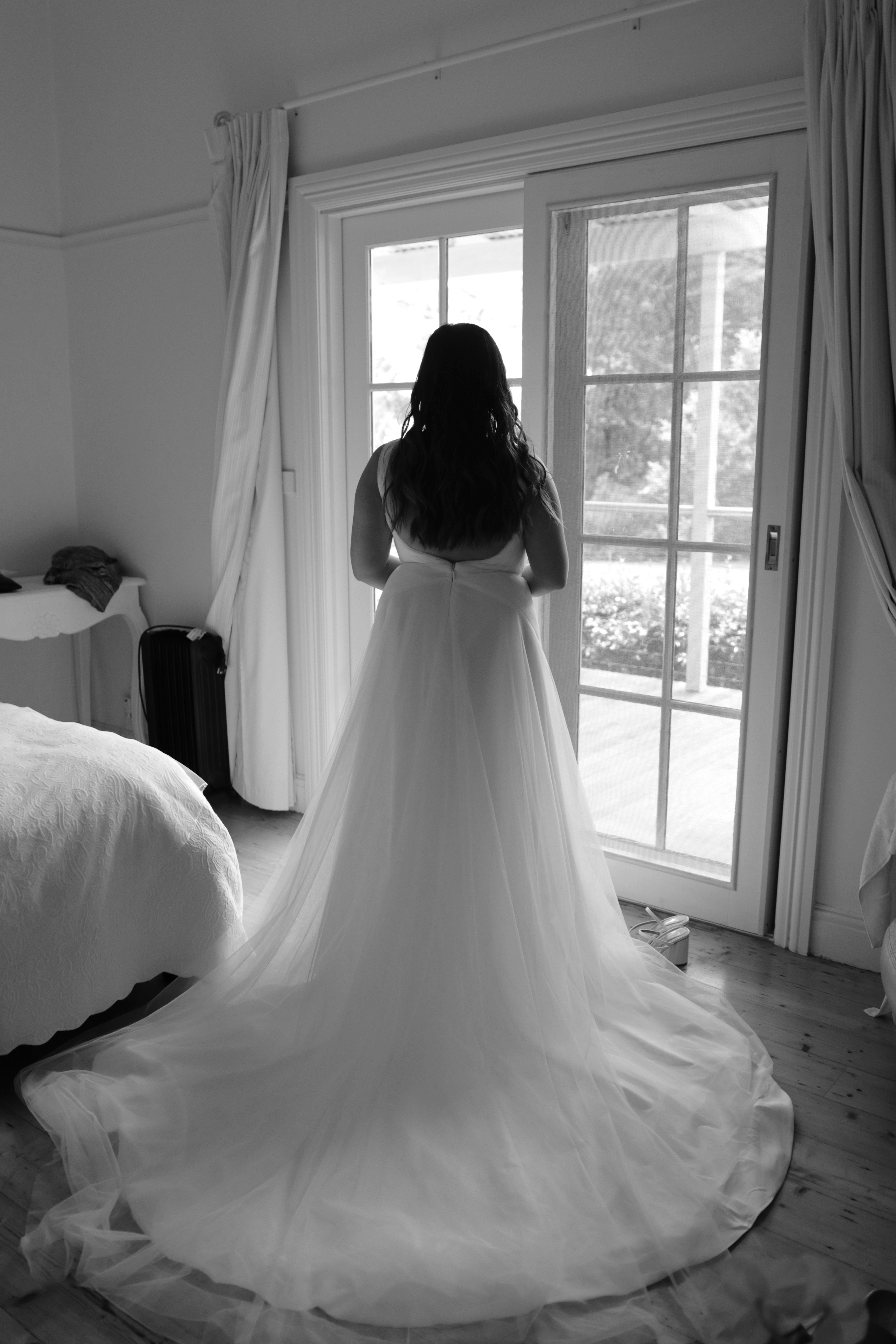 Backshot of a bride in a wedding gown | Source: Unsplash