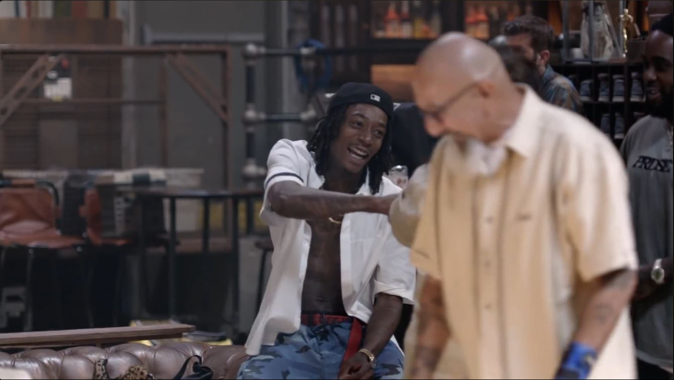 Wiz Khalifa shares a lighthearted moment with one of the Shatto Senior All Stars during the Taylor Gang Invitational Bowling Tournament. | Source: YouTube/Wiz Khalifa