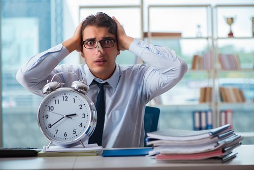 Time passing for smelly businessman. | Source: Shutterstock.
