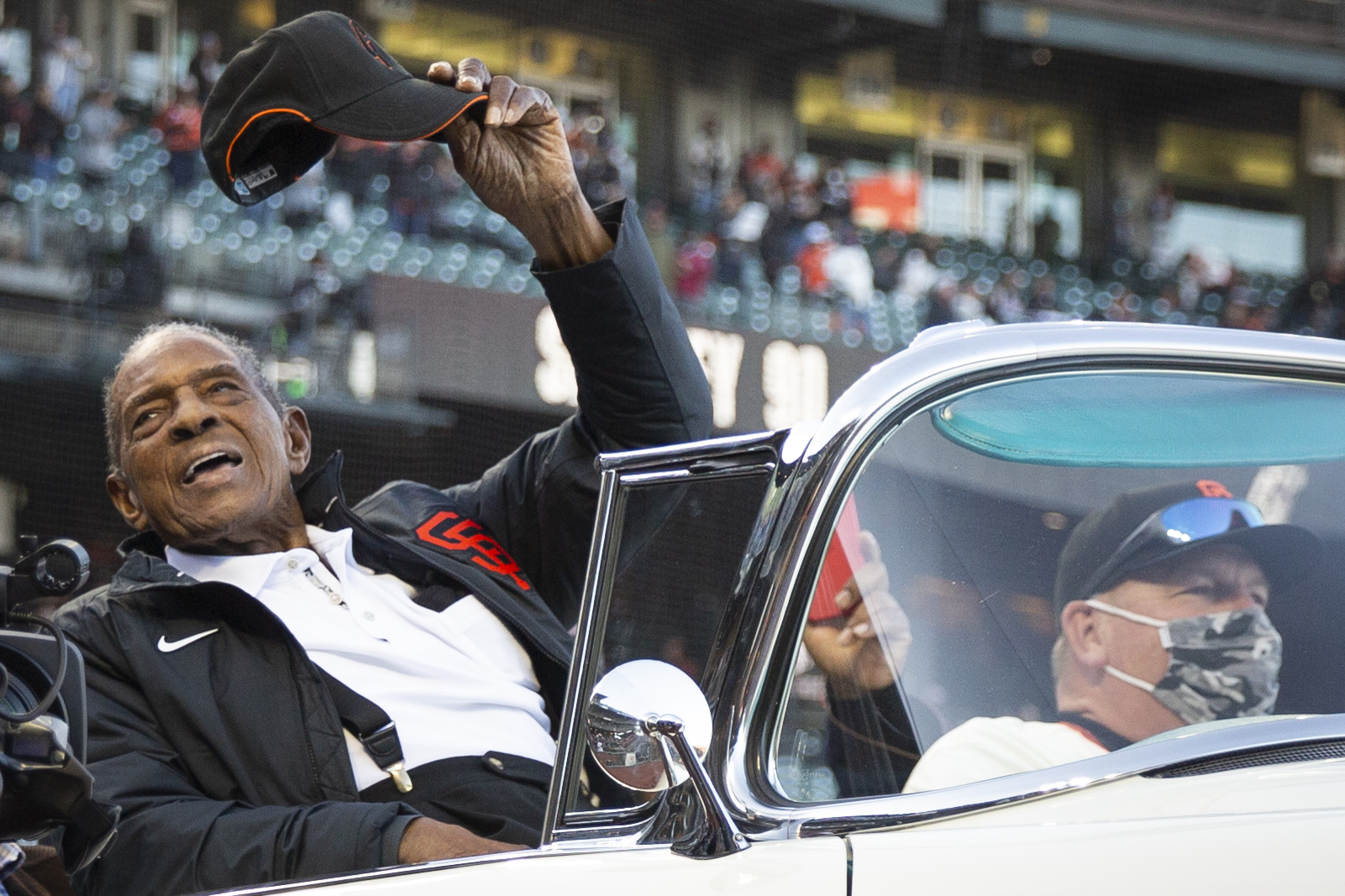 Willie Mays waves his hat while riding around Oracle Park on May 7, 2021, in San Francisco. | Source: Getty Images
