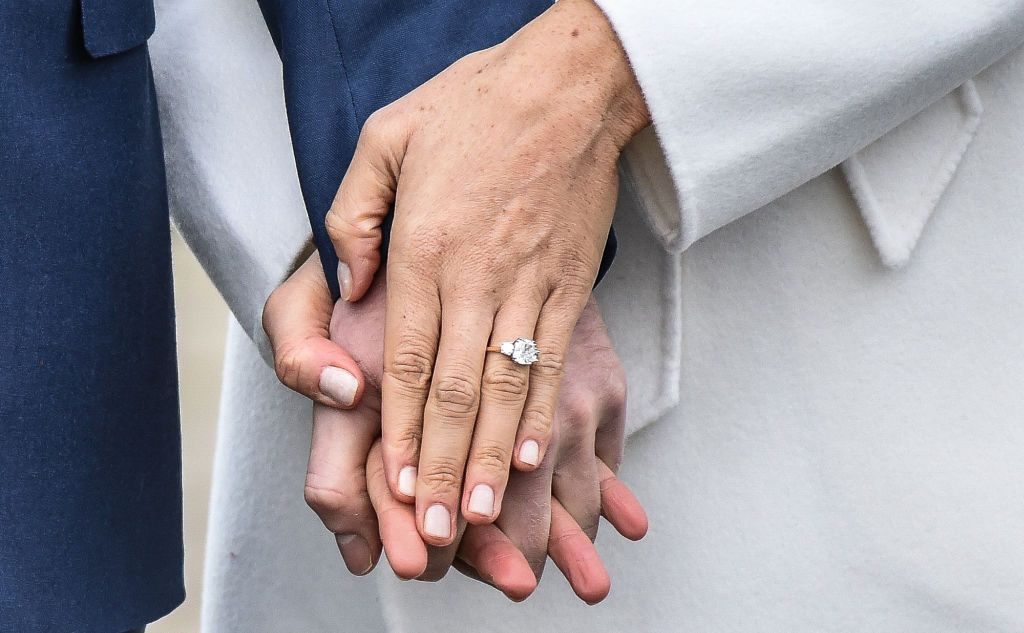 A close-up of Meghan Markle's engagement ring during an official photocall to announce her engagement to Prince Harry at Kensington Palace on November 27, 2017, in London, England. | Source: Samir Hussein/WireImage/Getty Images