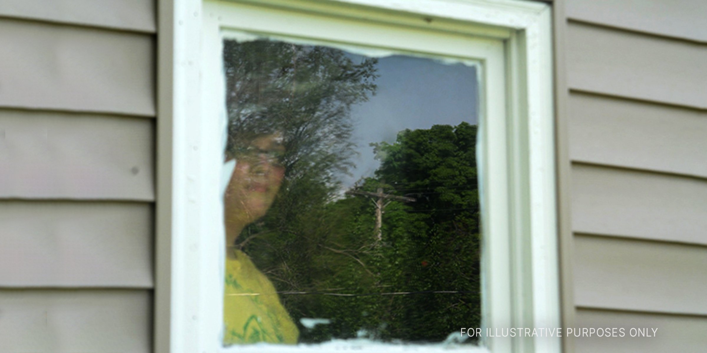 Source: Shutterstock | A woman in the window