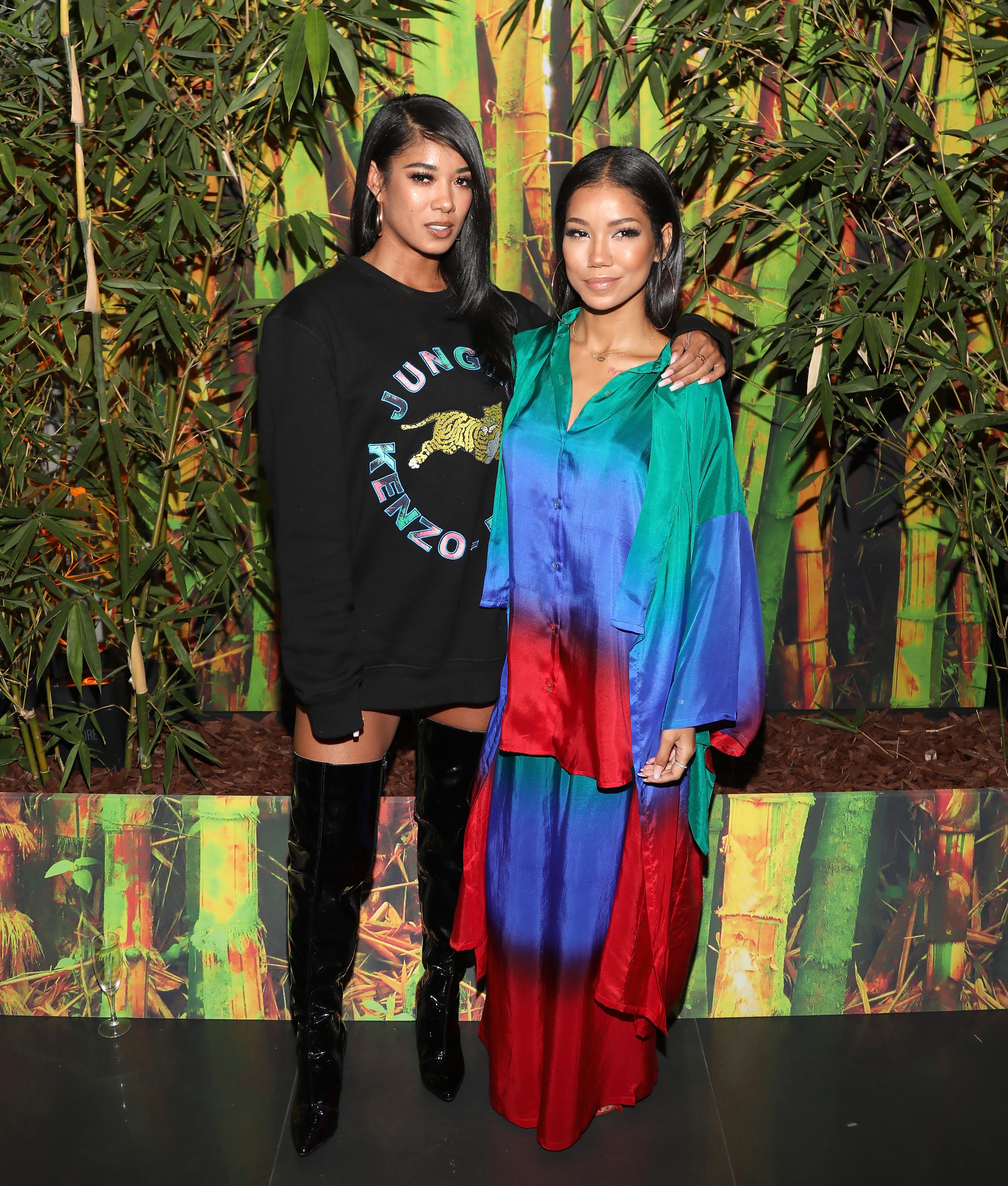Mila J and Jhene Aiko pose at Jhene Aiko’s TRIP launch party powered by Samsung at EB Gallery on September 22, 2017, in Los Angeles | Source: Getty Images
