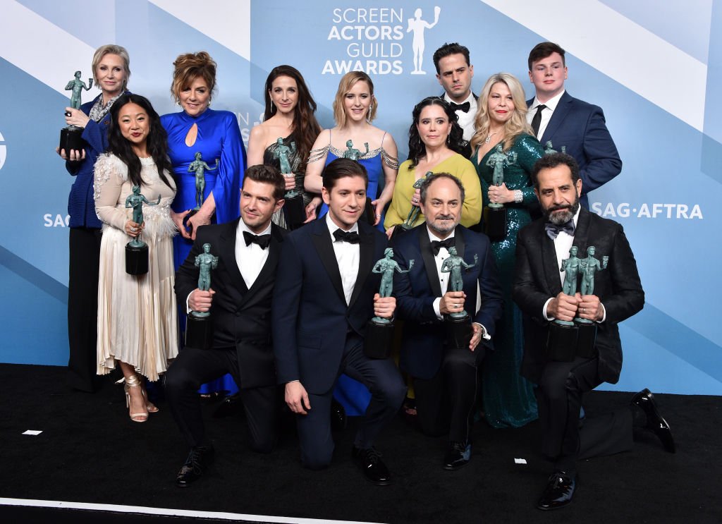 "The Marvelous Mrs. Maisel" cast pose with the trophy for Outstanding Performance by an Ensemble in a Comedy Series at the 26th Annual Screen Actors Guild Awards on January 19, 2020 | Photo: Getty Images
