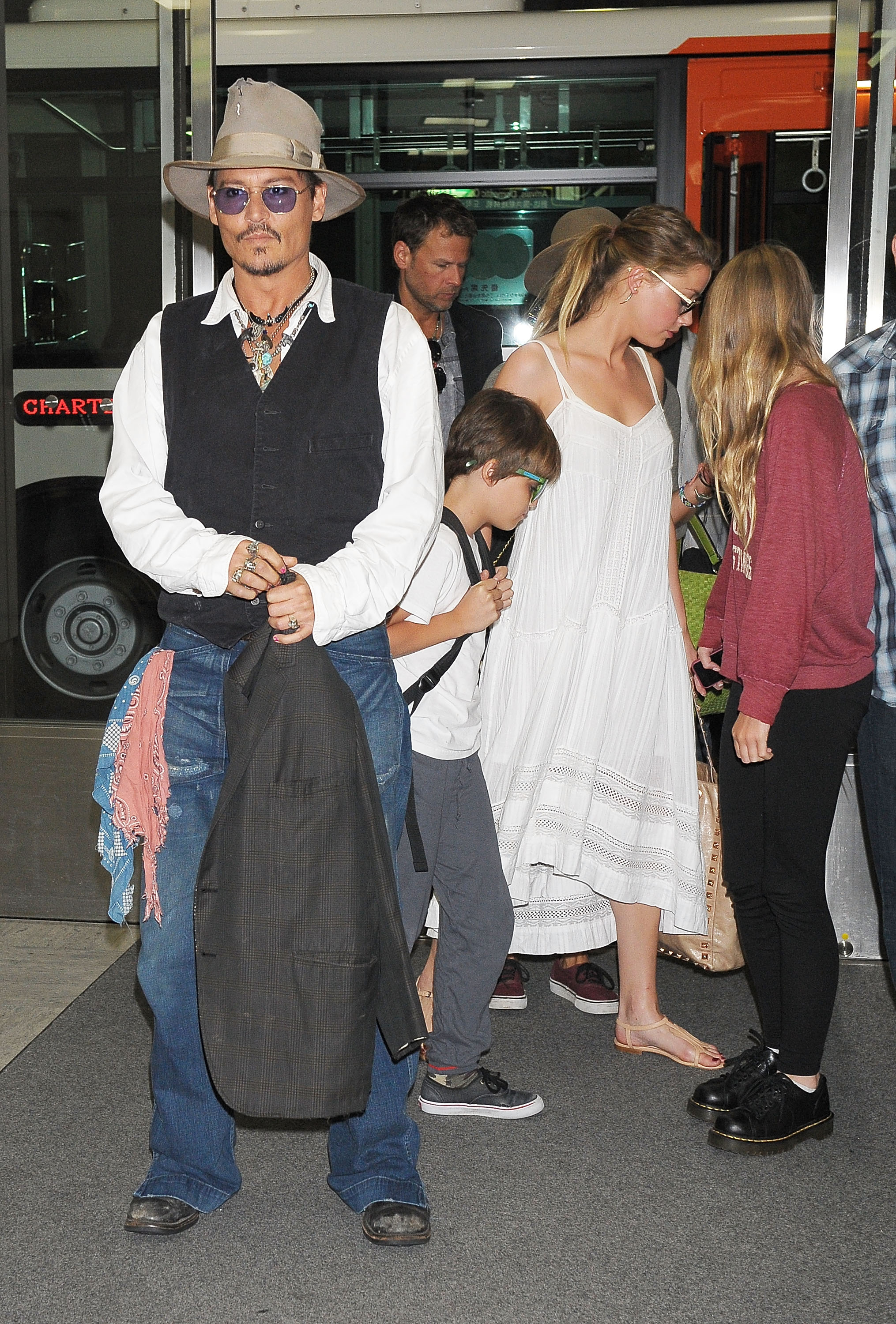 Johnny Depp, Jack Depp, Amber Heard and Lily Rose Melody Depp arrive at Narita International Airport on July 16, 2013 in Narita, Japan. | Source: Getty Image