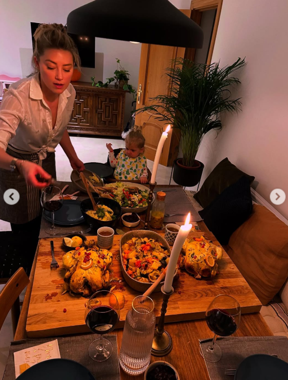 Amber Heard is pictured with her daughter, Oonagh, from a post dated November 27, 2025 | Source: Instagram/amberheard