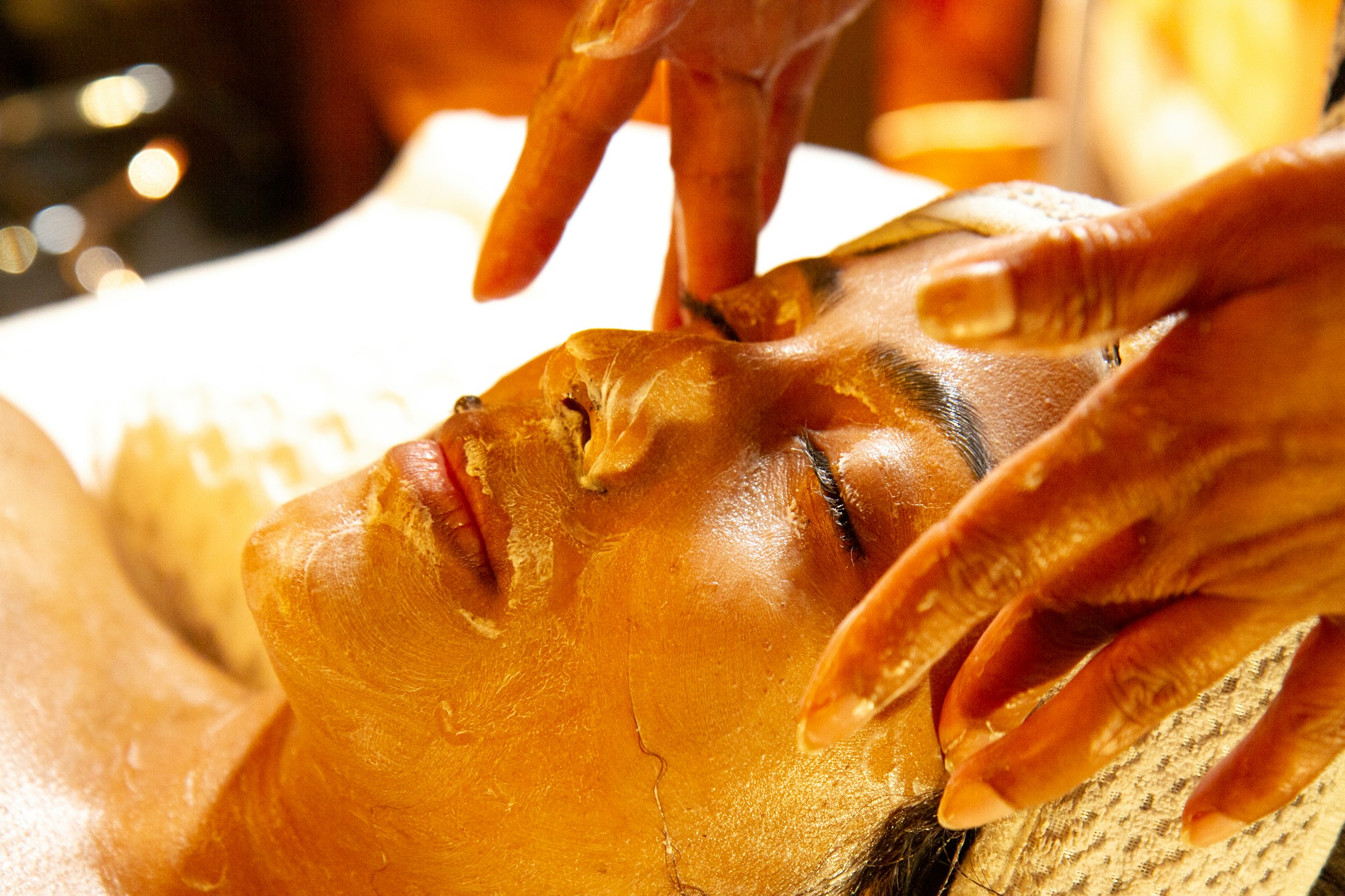 A woman getting a gold facial | Source: Unsplash