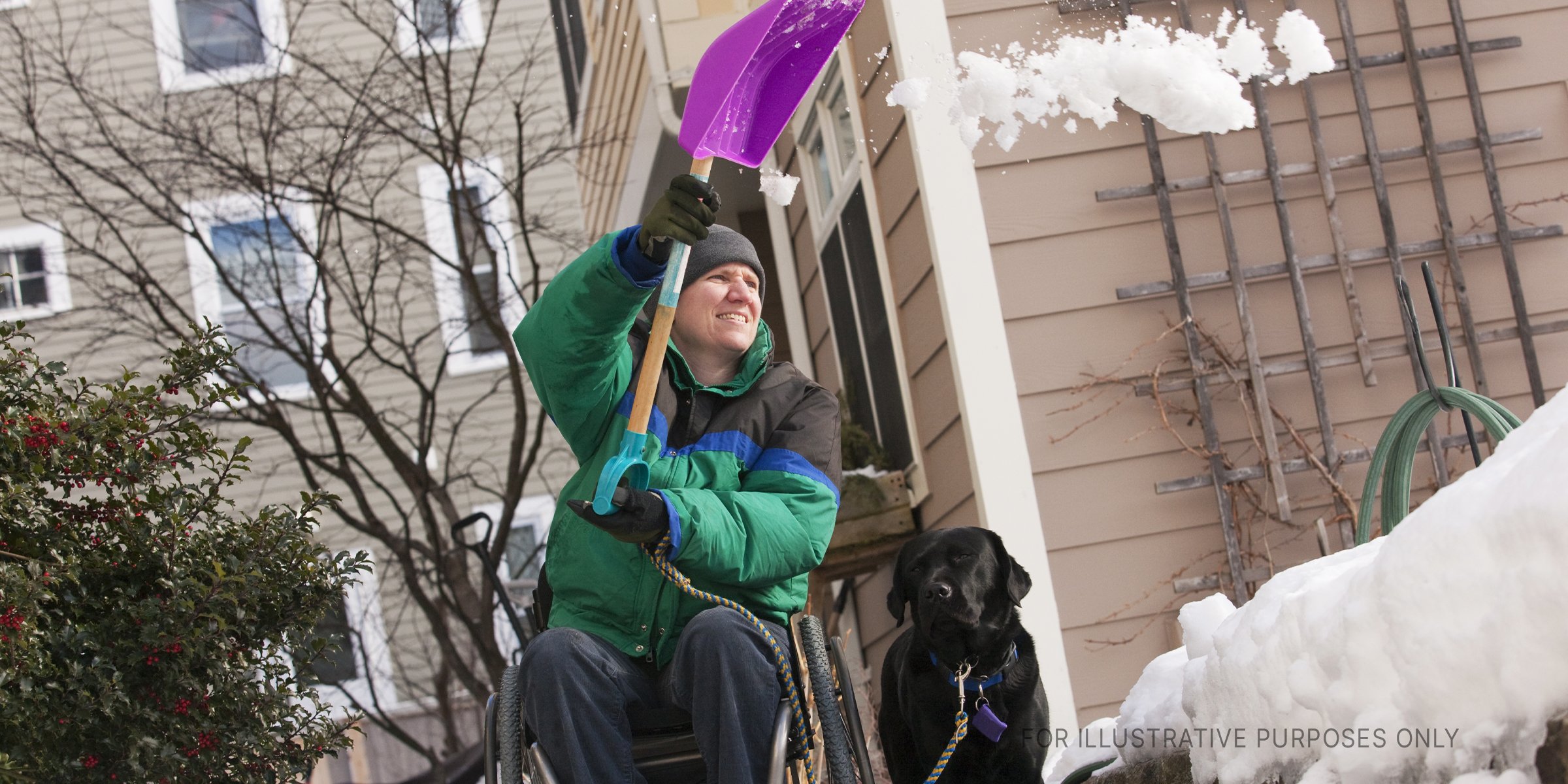 Wheelchaired Man Shoveling Snow. | Source: Getty Images