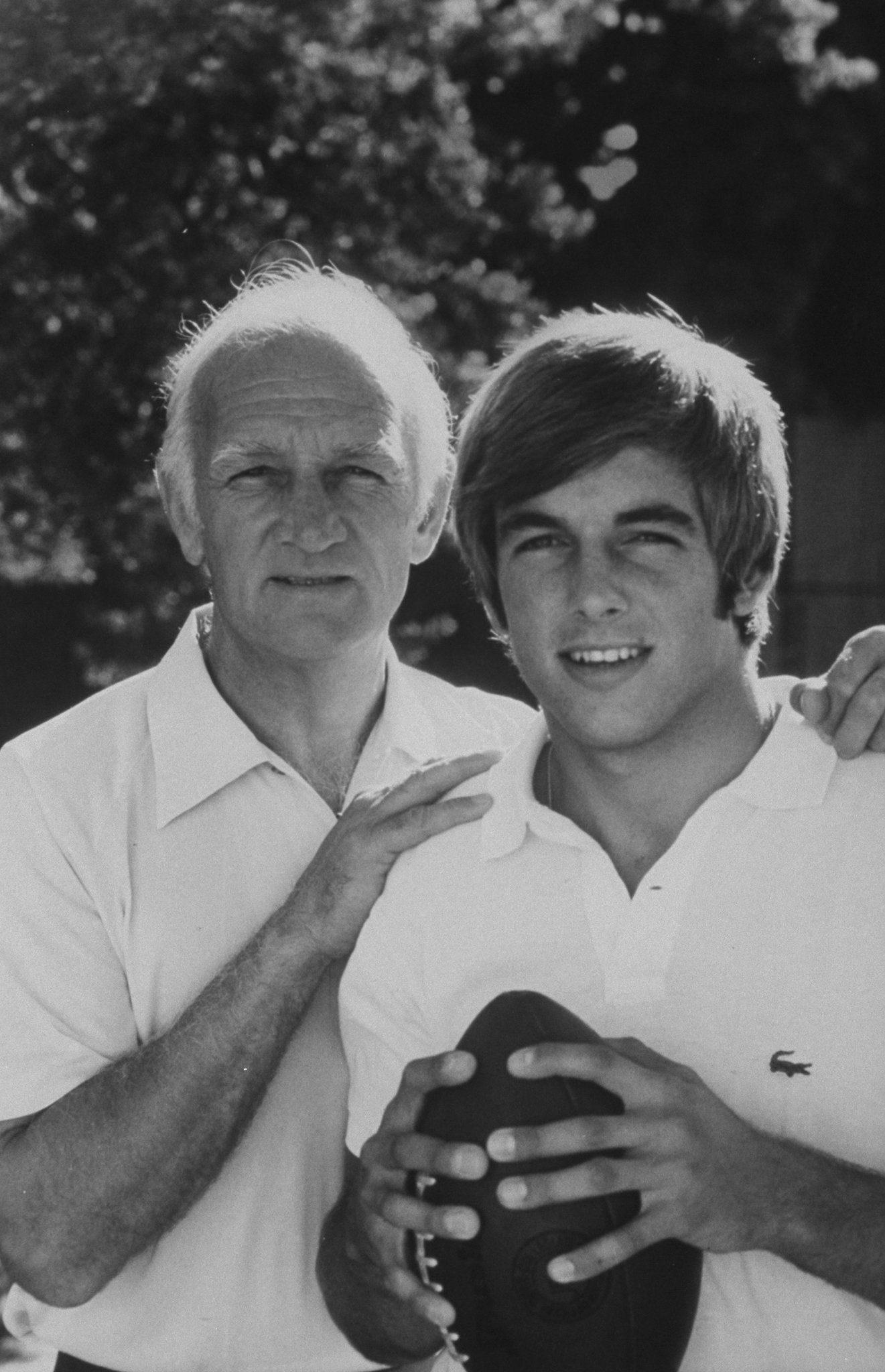 Former Michigan football superstar Tom Harmon posing with his son Mark who is U.C.L.A.'s quarterback. | Source: Getty Images