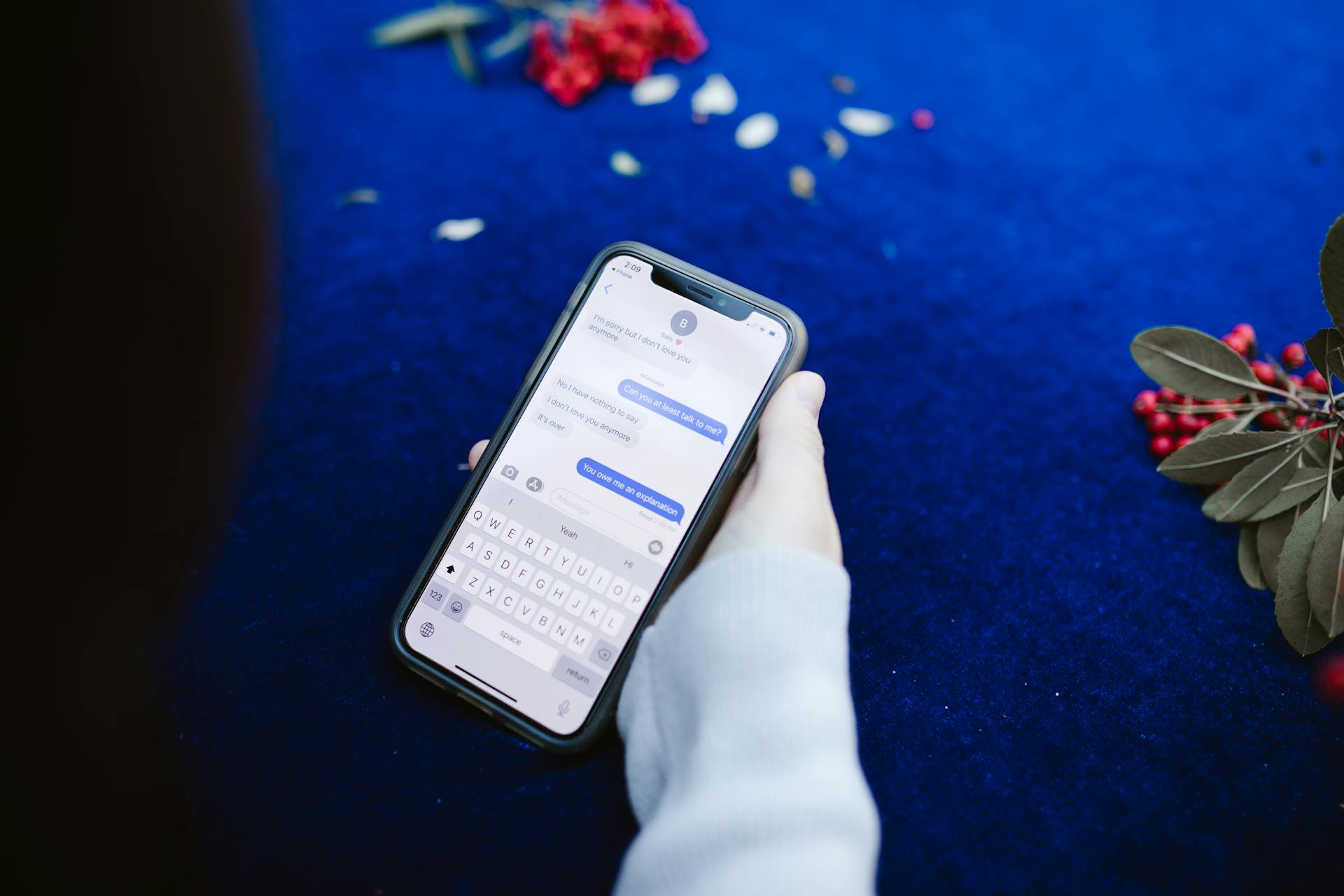 A person reading text messages on their phone | Source: Pexels