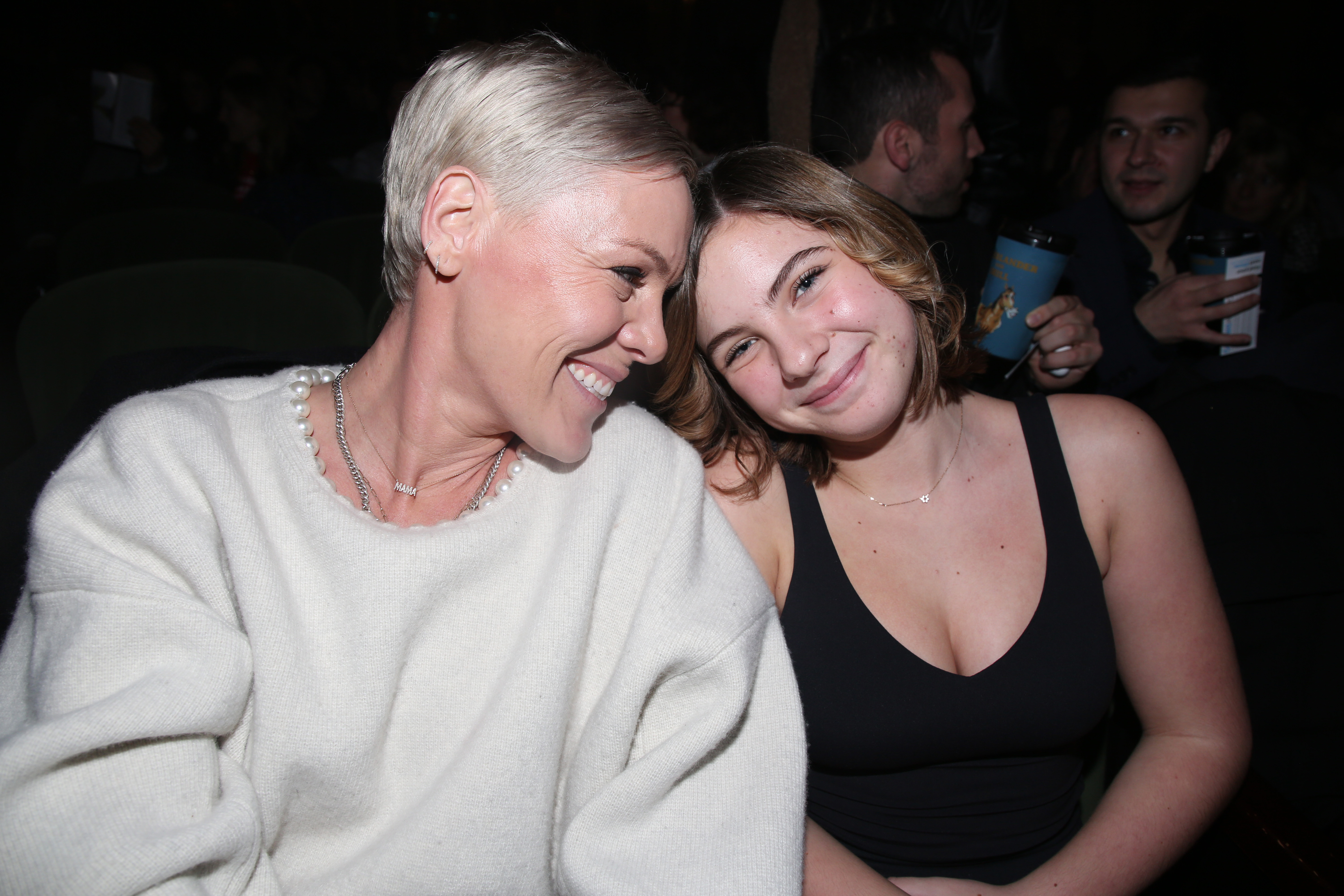 Pink and Willow Sage Hart share a close smile at the "All Out: Comedy About Ambition" gala performance on December 18, in New York City. Pink wears a soft white sweater while Willow poses in black.