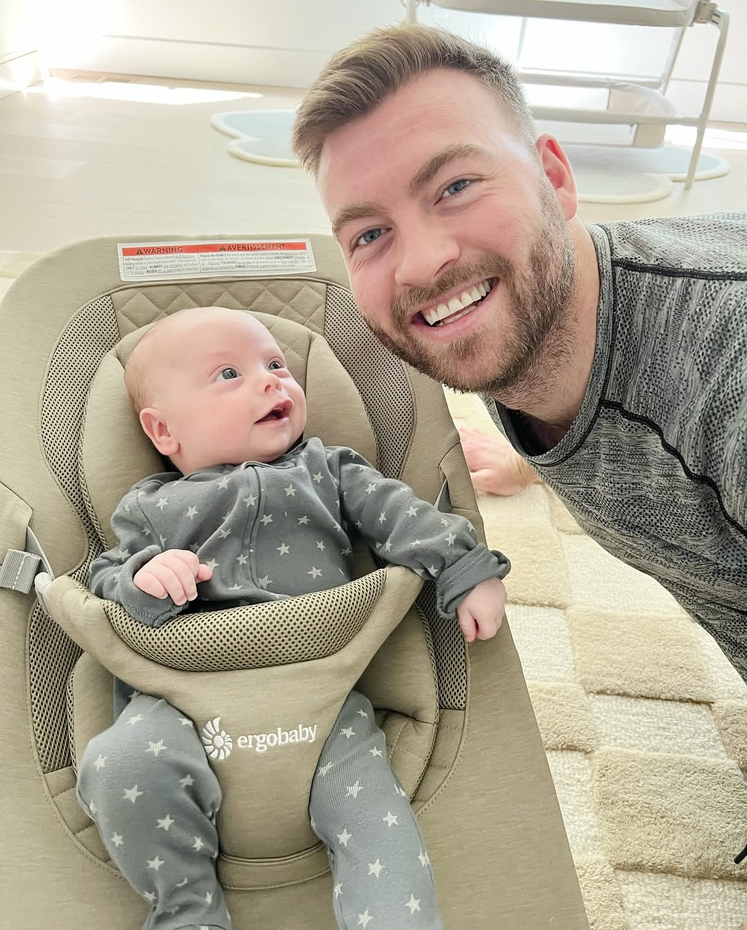 Evan McClintock holding his son, Elliot, on Hailie Jade Scott's Father's Day post from June 15, 2025 | Source: Instagram/hailiejade