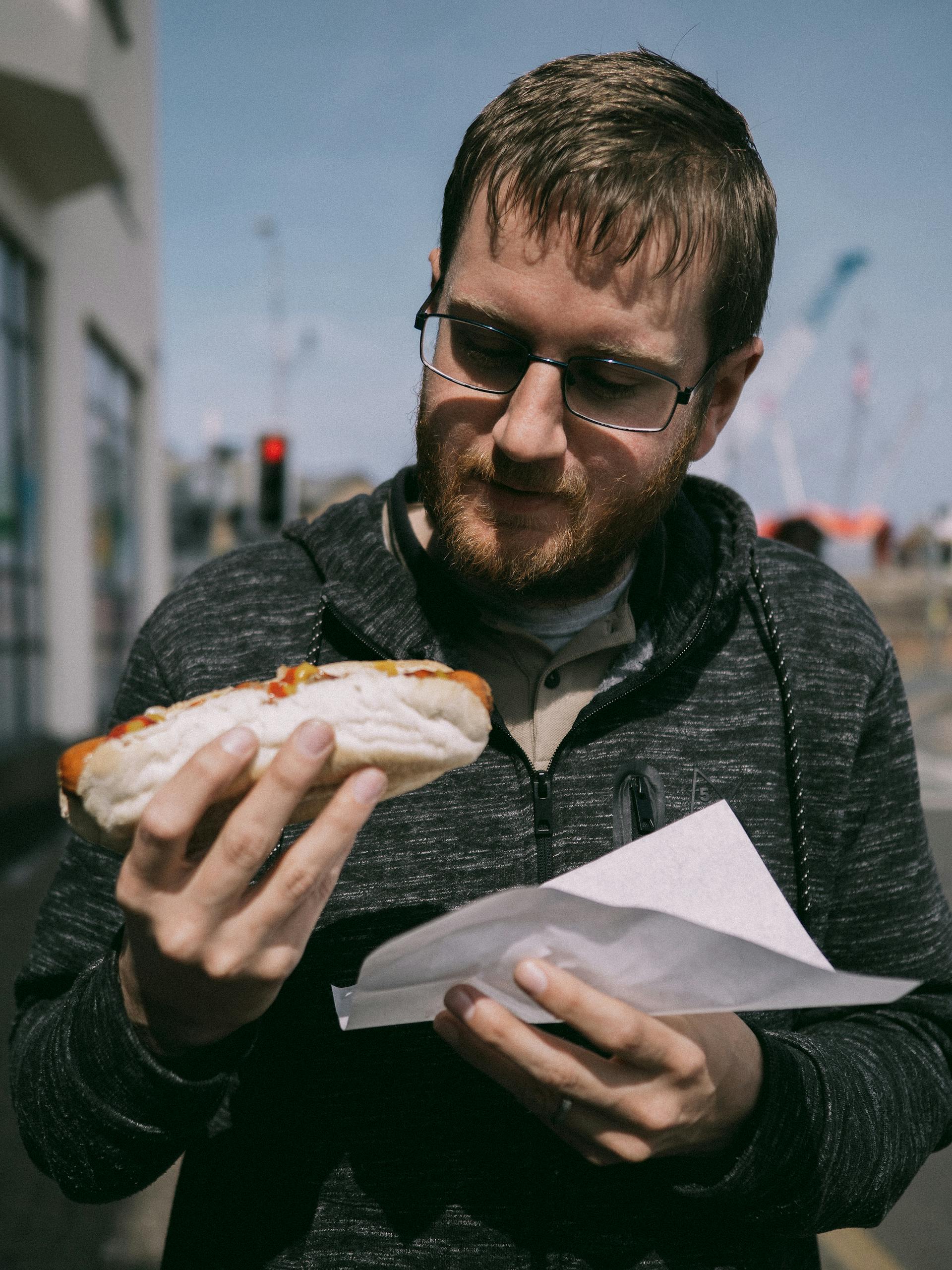 A man about to eat a hotdog | Source: Pexels