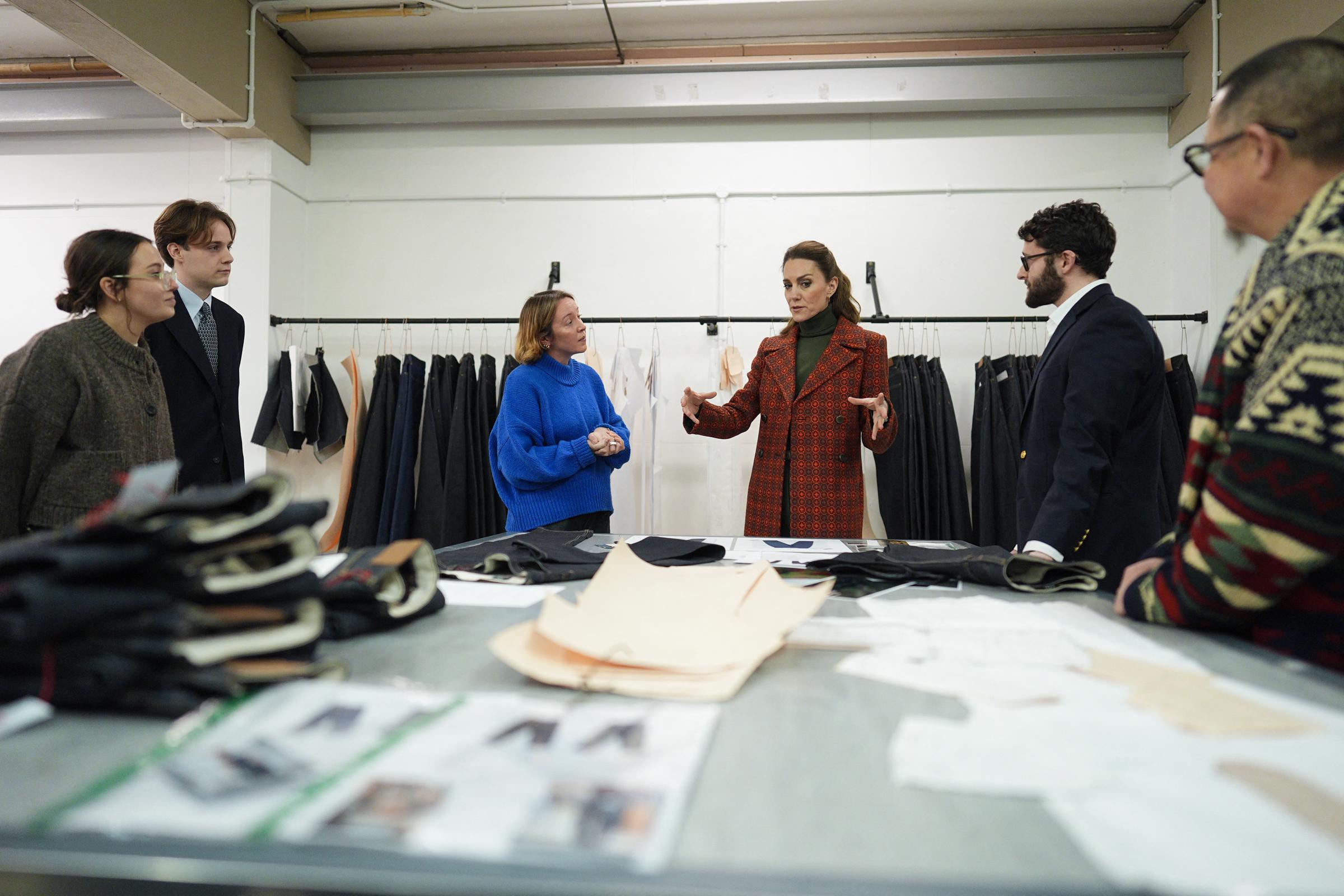 Catherine, Princess of Wales speaks with members of the design team during a visit to Hiut Denim, a family-owned company designing and manufacturing premium jeans, on 3 February 2026 in Cardigan, Wales. | Source: Getty Images