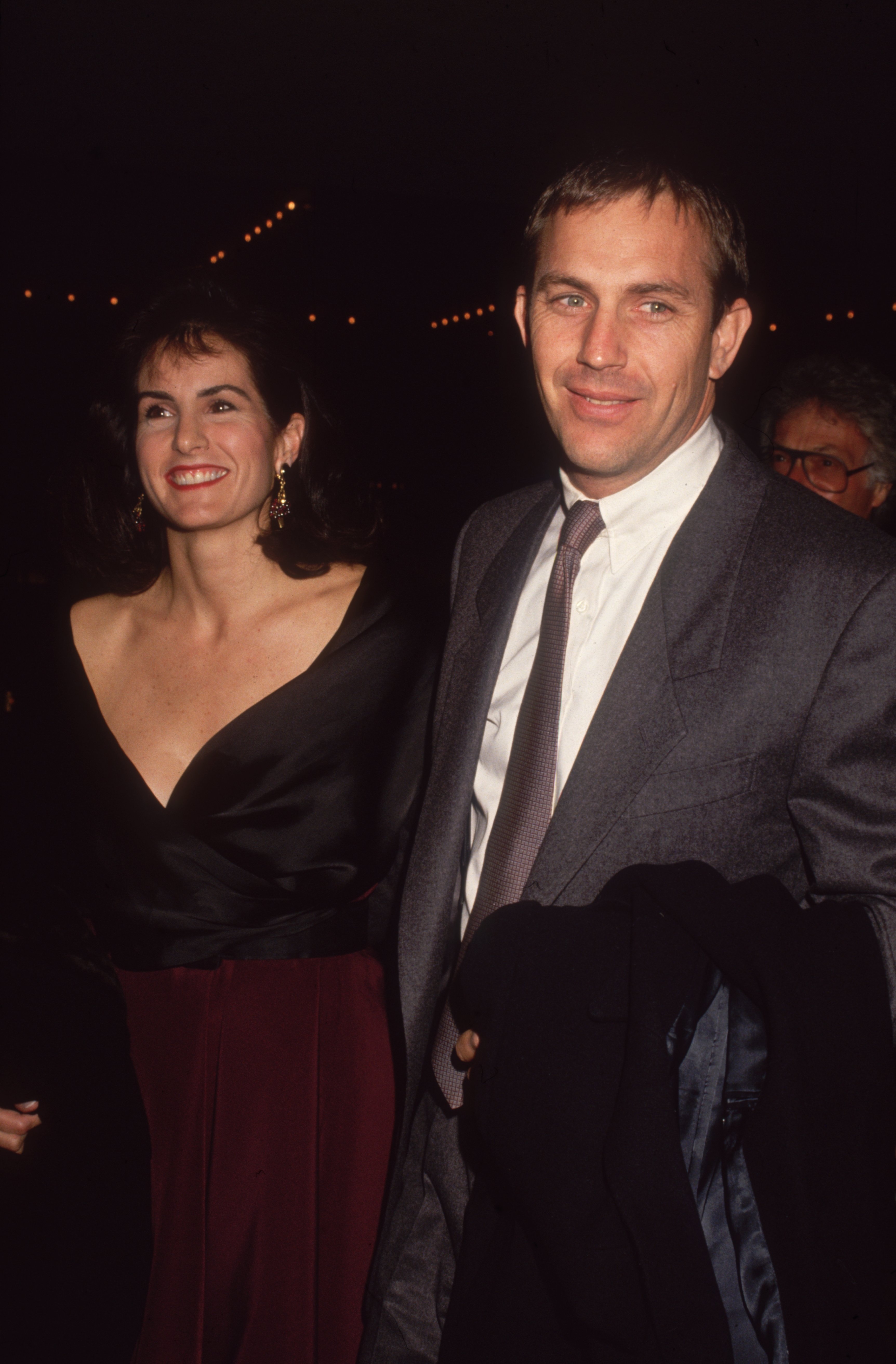  American actor Kevin Costner and his wife, Cindy Silva, smile while arriving at a semiformal event. | Source: Getty Images