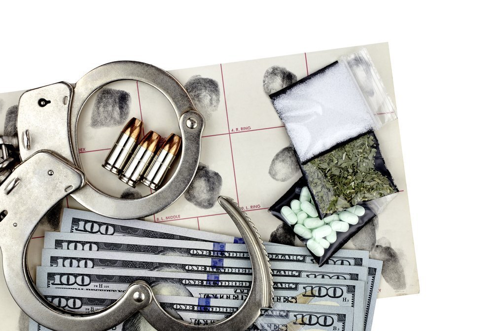 Handcuffs and Drug Paraphernalia, Shutterstock