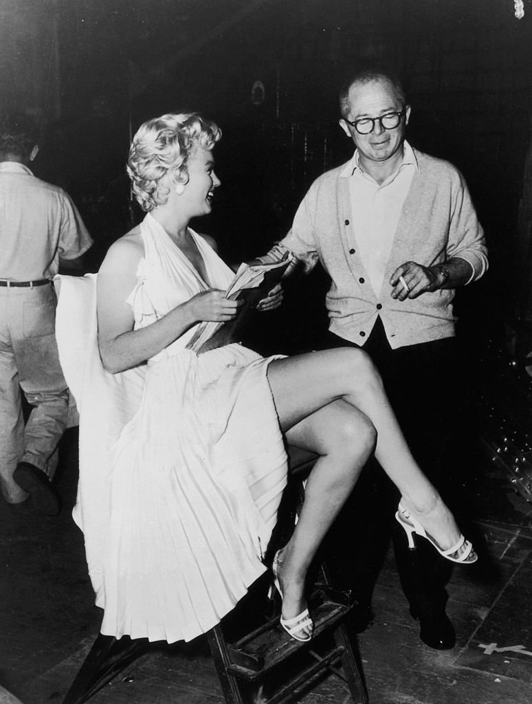 Marilyn Monroe and Billy Wilder on the set of “The Seven Year Itch” on January 1, 1955 | Source: Getty Images 