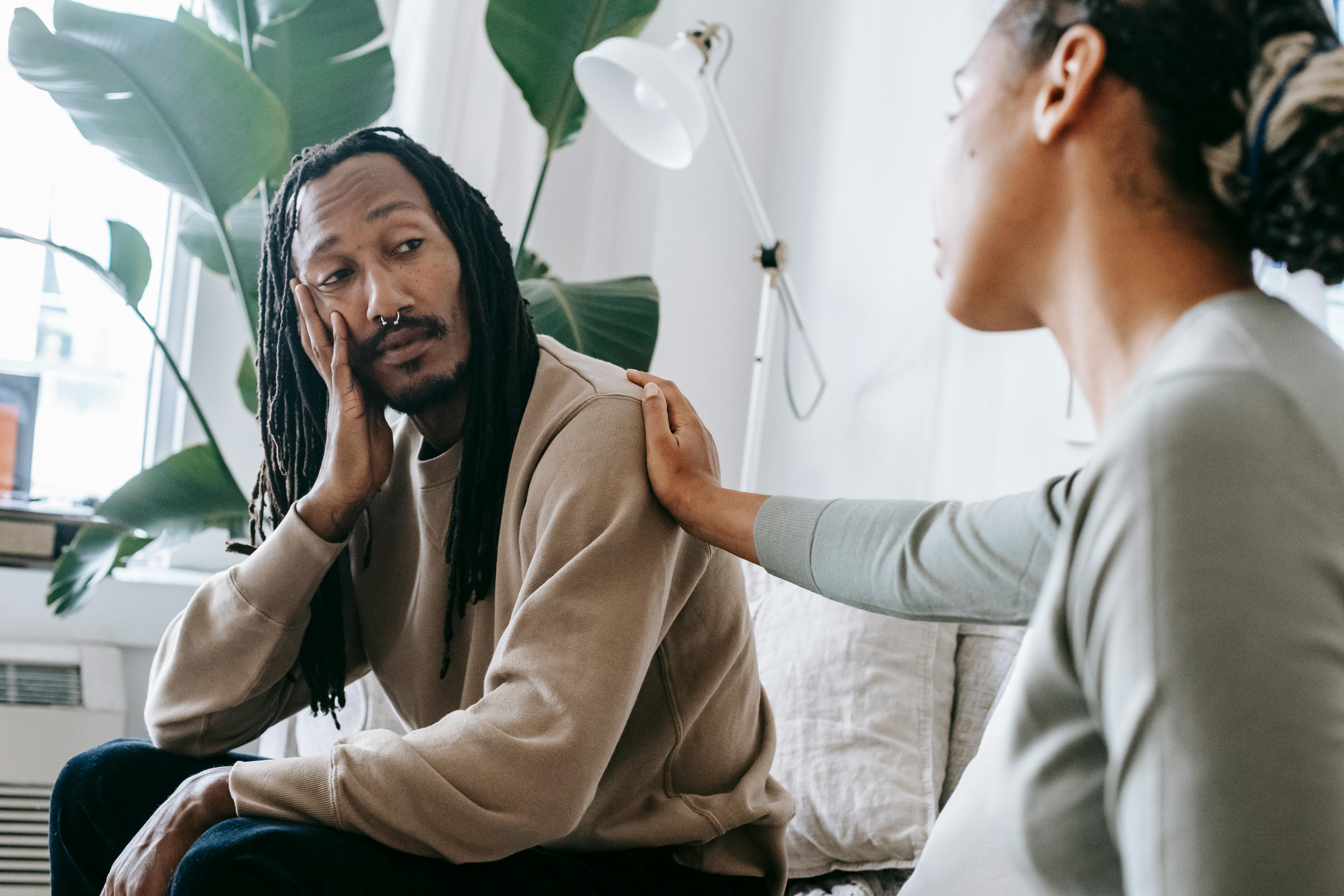 A woman comforting a depressed man | Source: Pexels