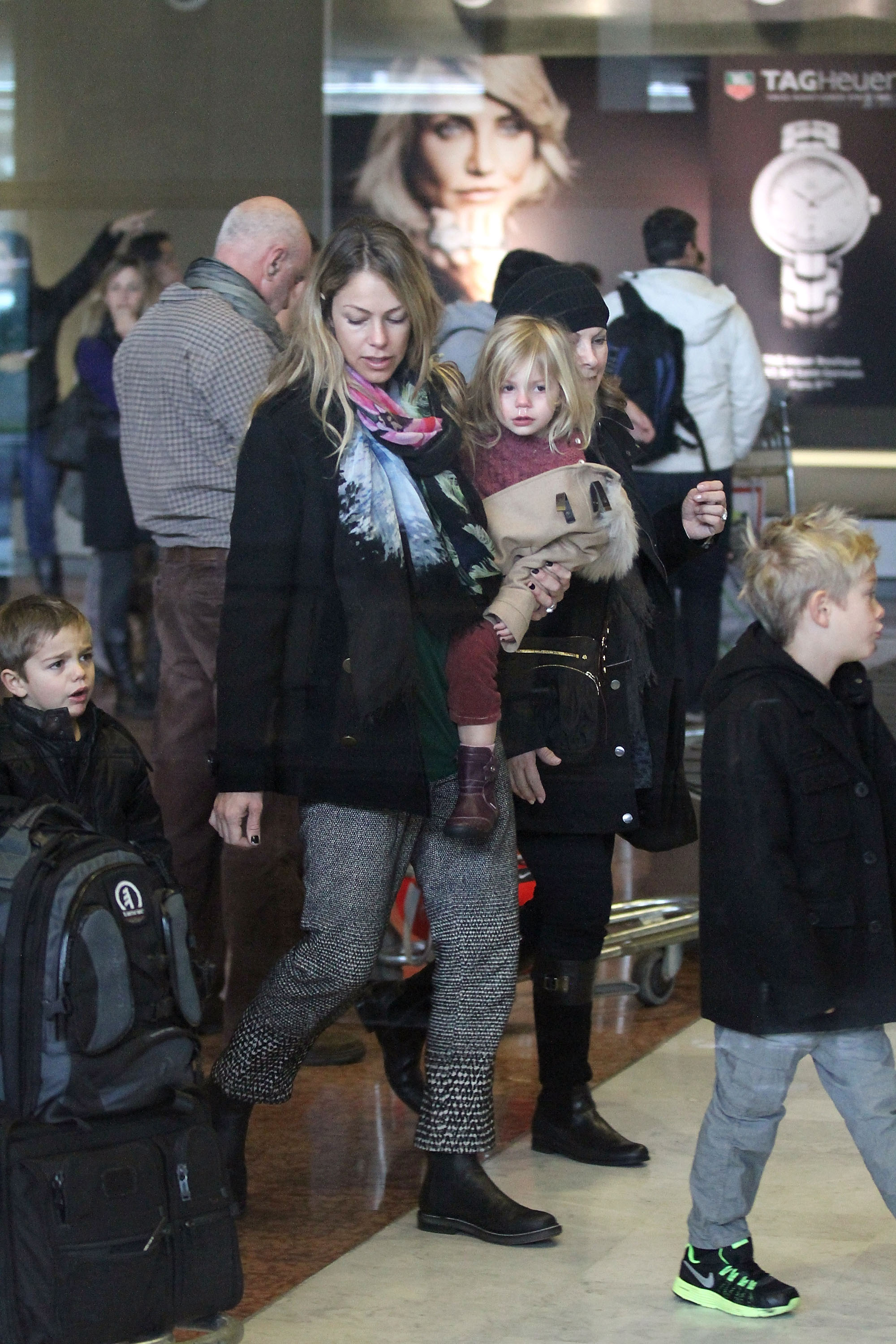 Christine Baumgartner with her children Grace Avery, Hayes Logan, and Cayden Costner on January 15, 2013 in Paris, France | Source: Getty Images