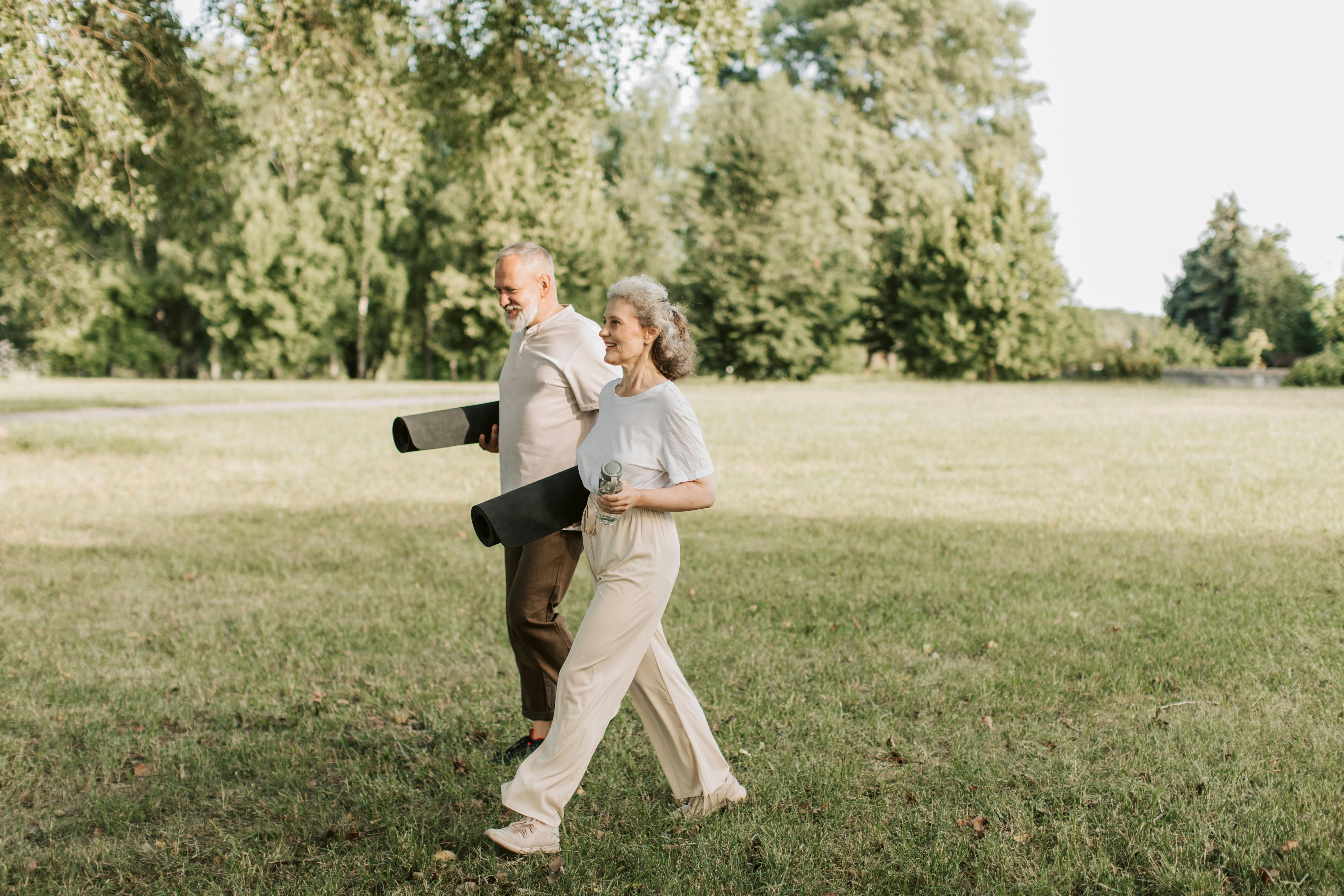 An older couple walking at the park | Source: Pexels