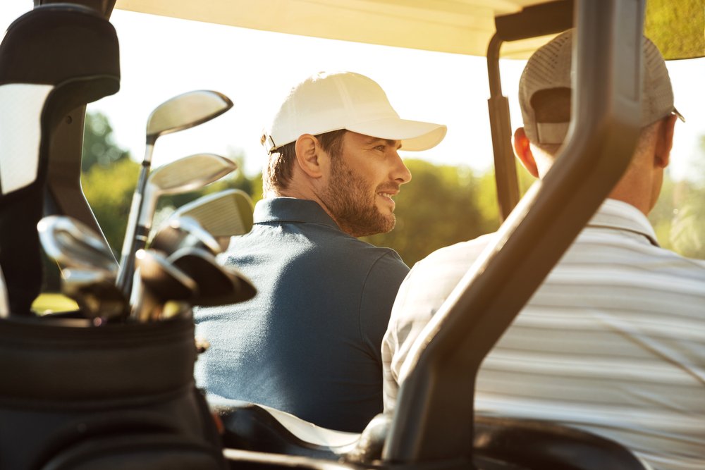 A photo of two friends out golfing | Photo: Shutterstock