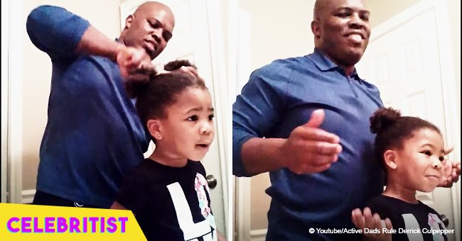 3-year-old girl keeps her father encouraged while he tries to style her hair