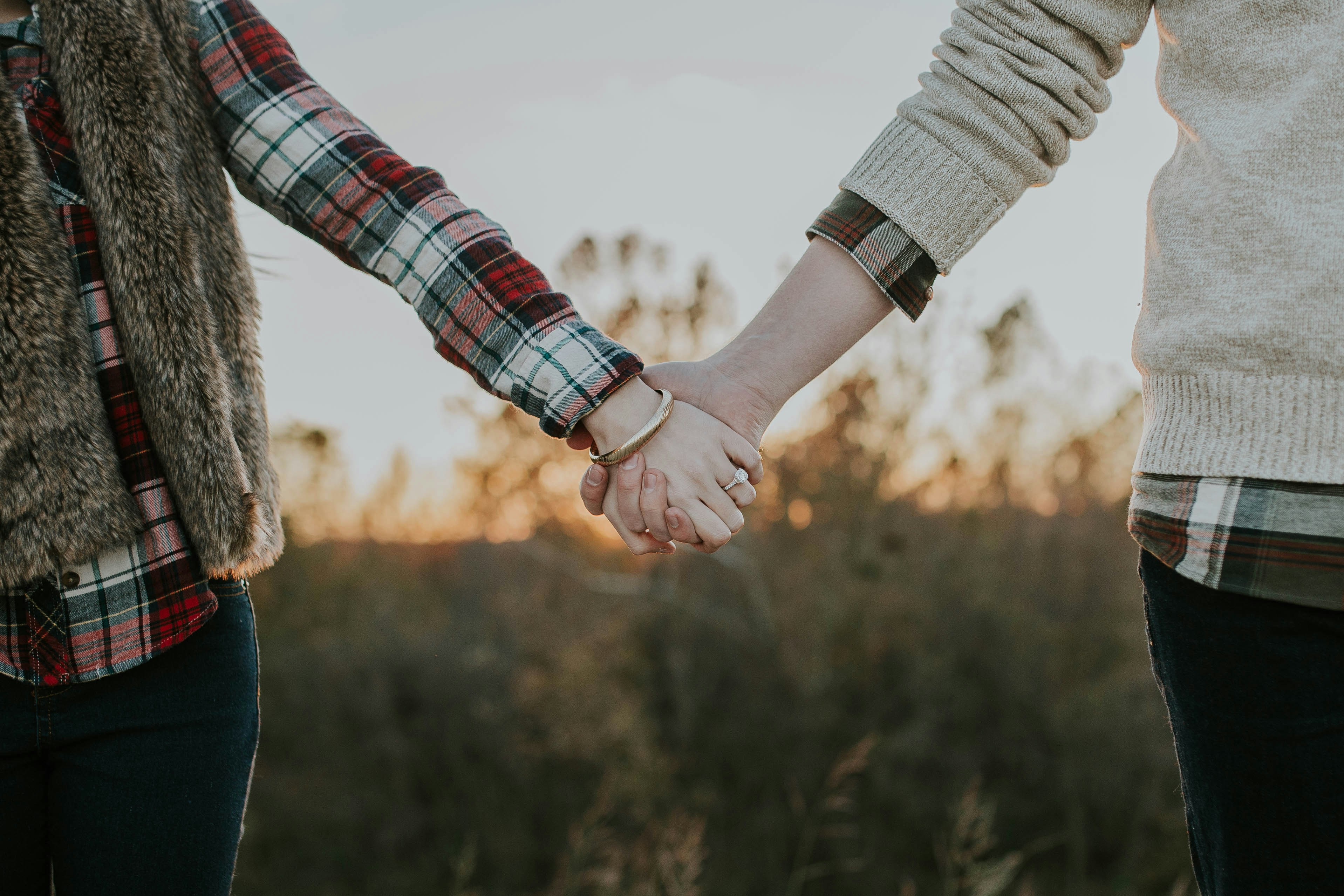 A couple holding hands | Source: Unsplash