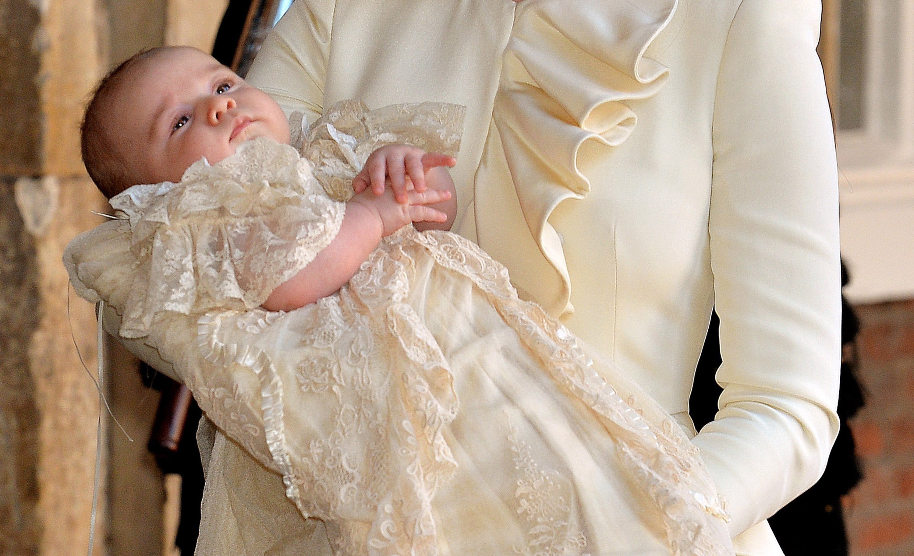 Catherine, Duchess of Cambridge carries her son Prince George Of Cambridge after his christening on October 23, 2013 in London, England. | Photo: Getty Images